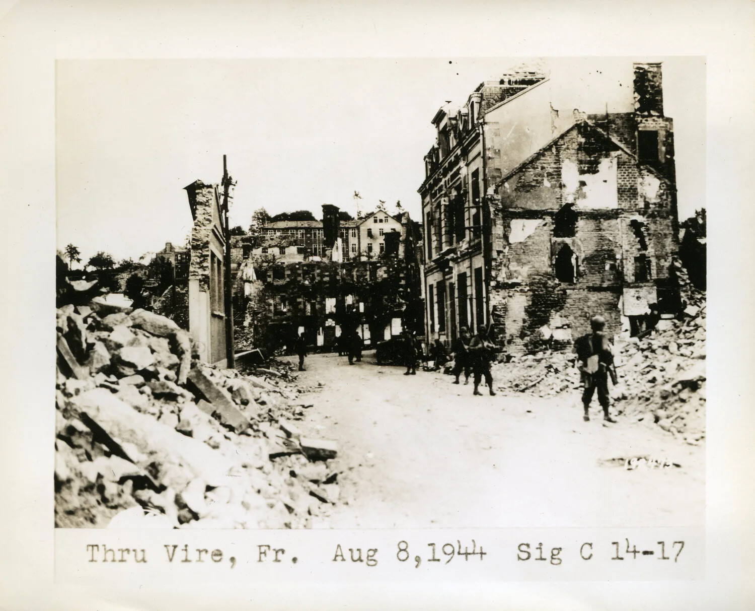 US Army Signal Corps Photograph: American Troops Advance Through the Ruins of Vire, France, August 8, 1944