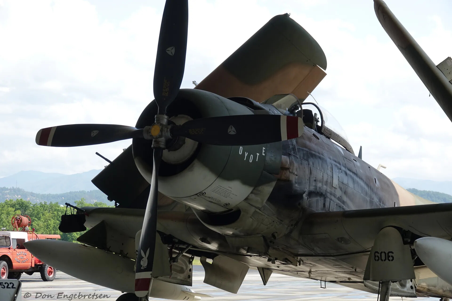 A-1 Skyraider "Coyote" Nose Art and Propeller Detail with Fire Truck in Background