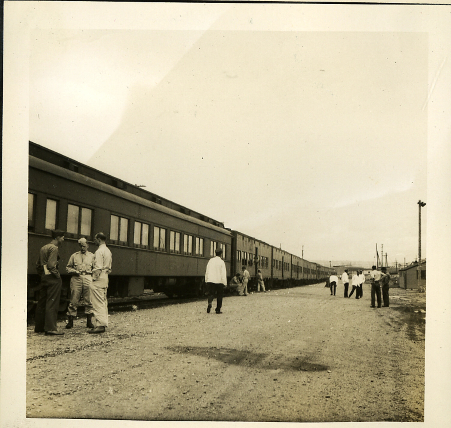 American Servicemen and Japanese Civilians at a Railway Siding, Postwar Japan
