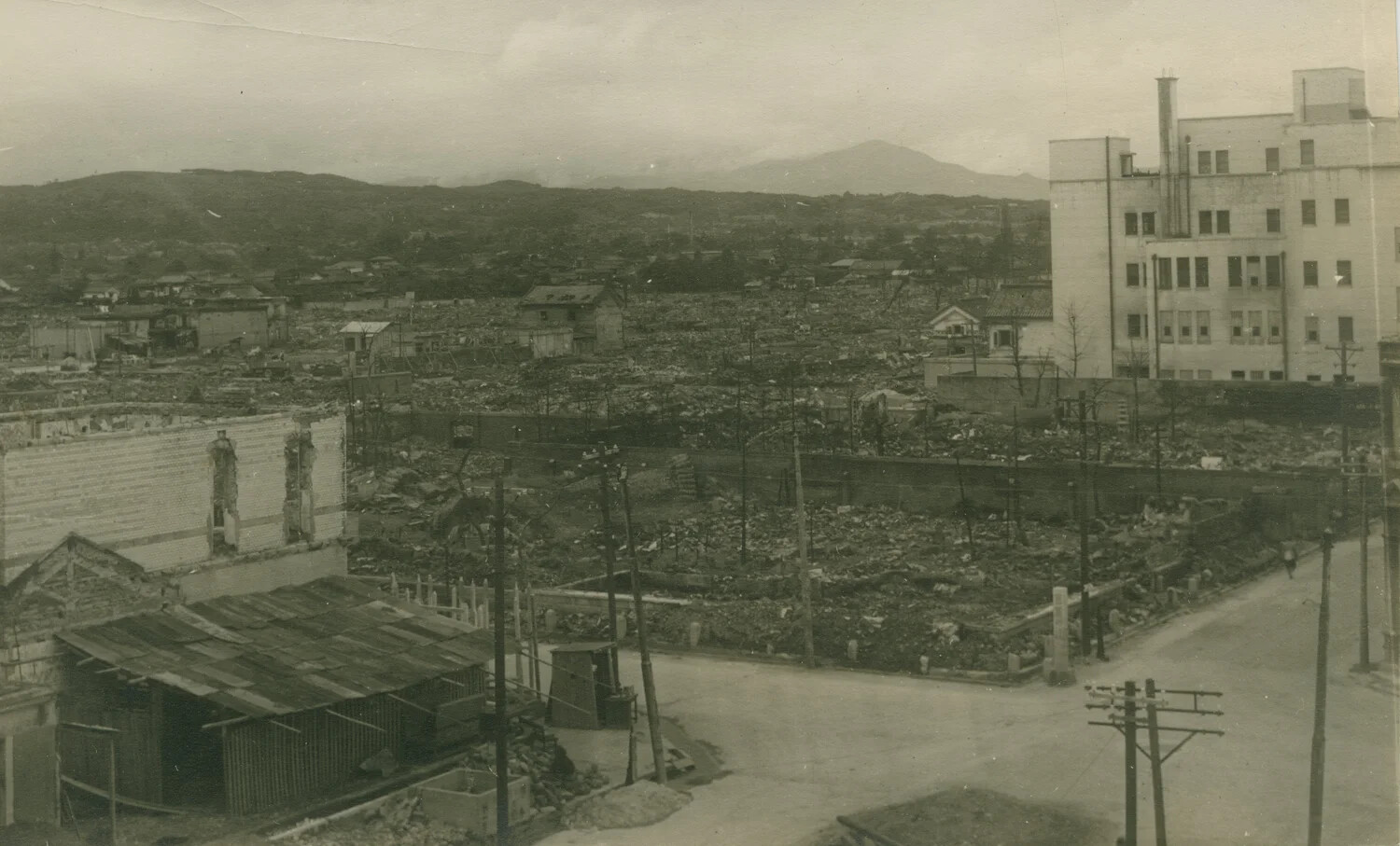 Panoramic View of Firebombed Japanese City with Surviving High-Rise Building, 1945