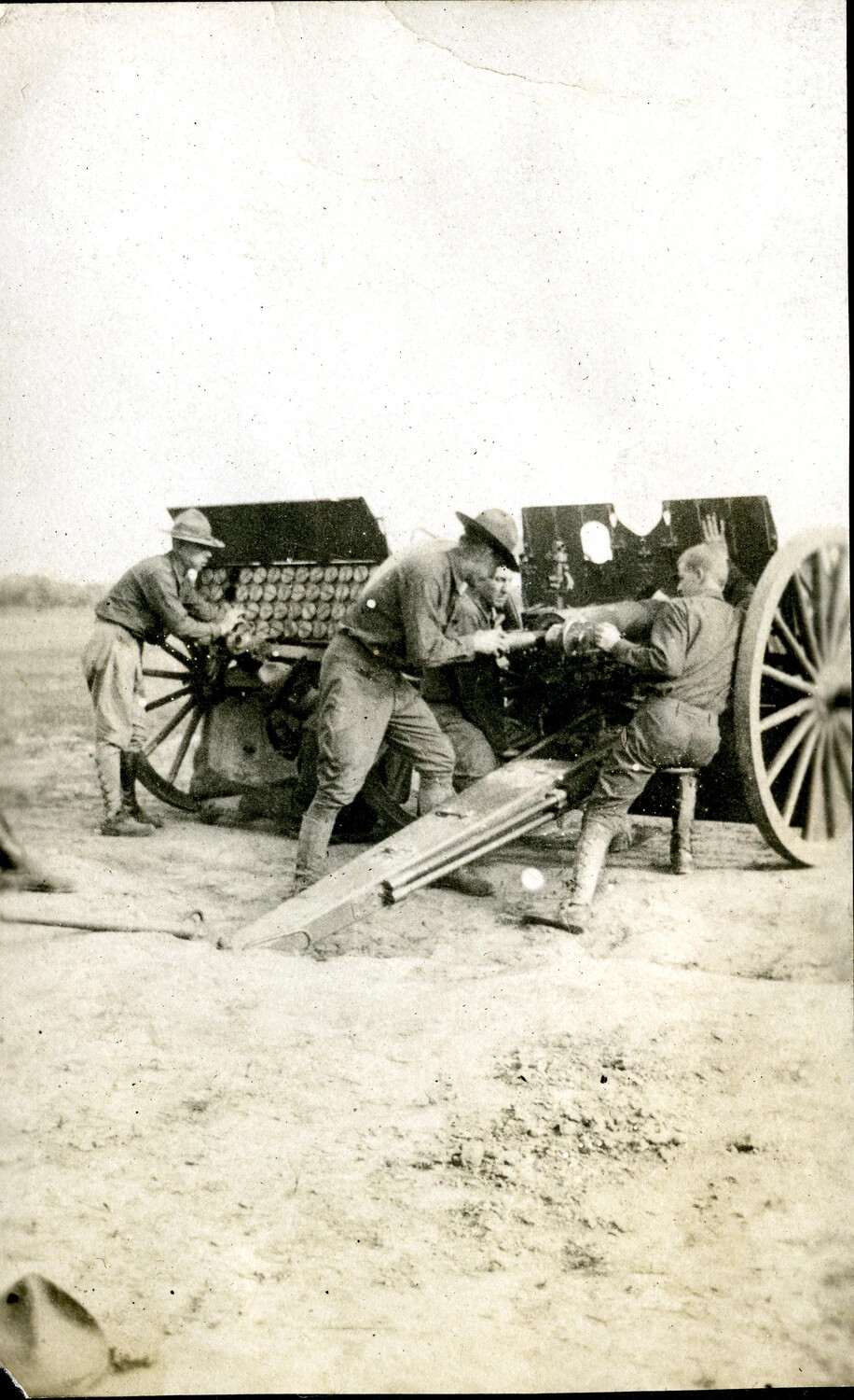 Gun Crew of Battery F, 124th Field Artillery, Servicing a 75mm Field Gun, WWI
