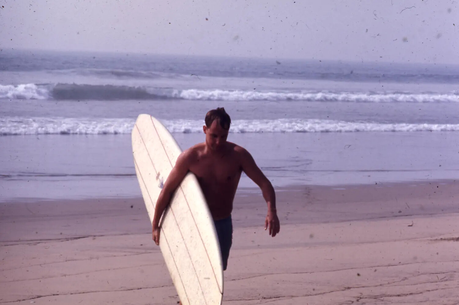 Sailor Carrying Longboard Surfboard on Beach, Vietnam-Era Liberty