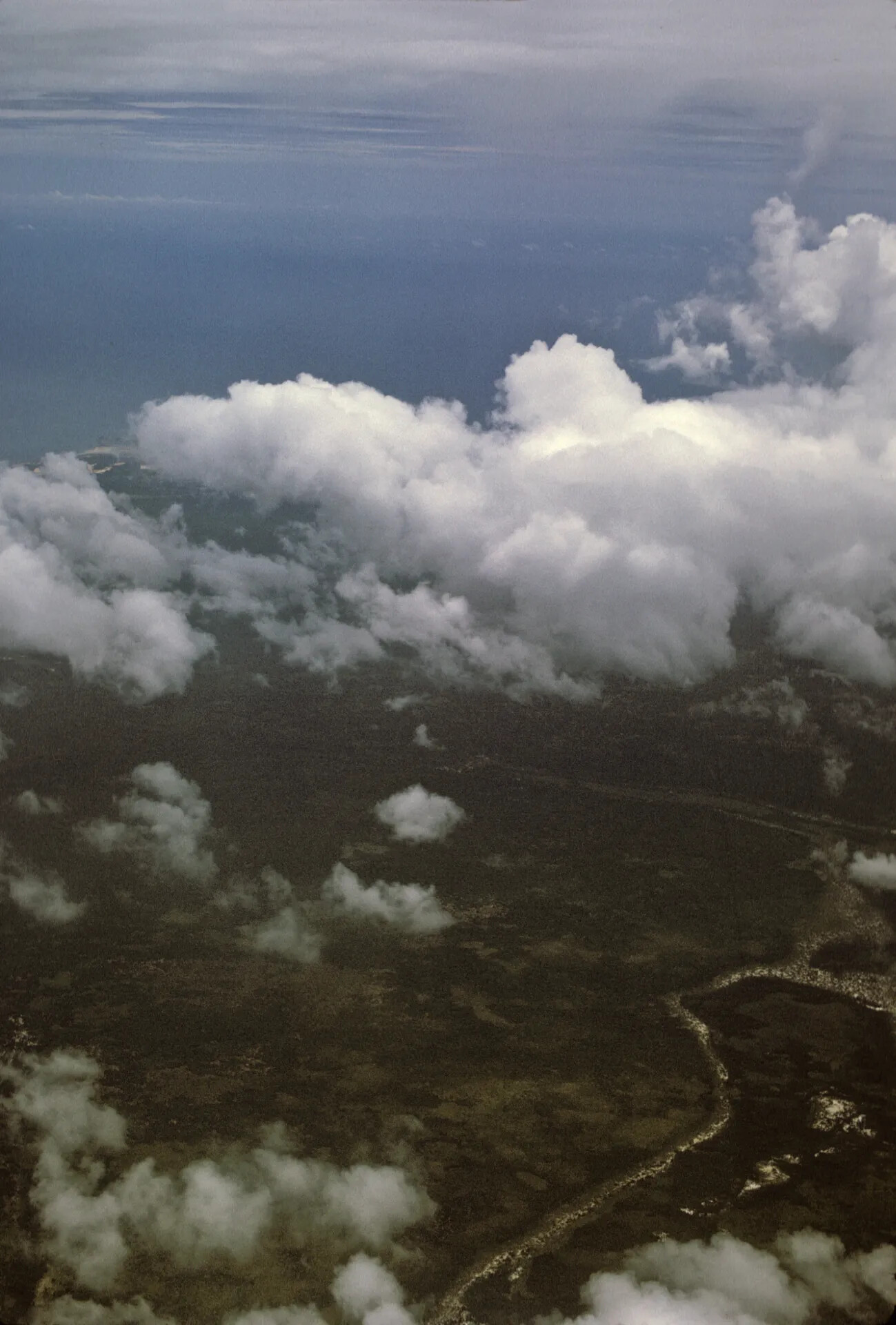 Aerial View of Coastline and Cumulus Clouds, Southeast Asia, October 1969