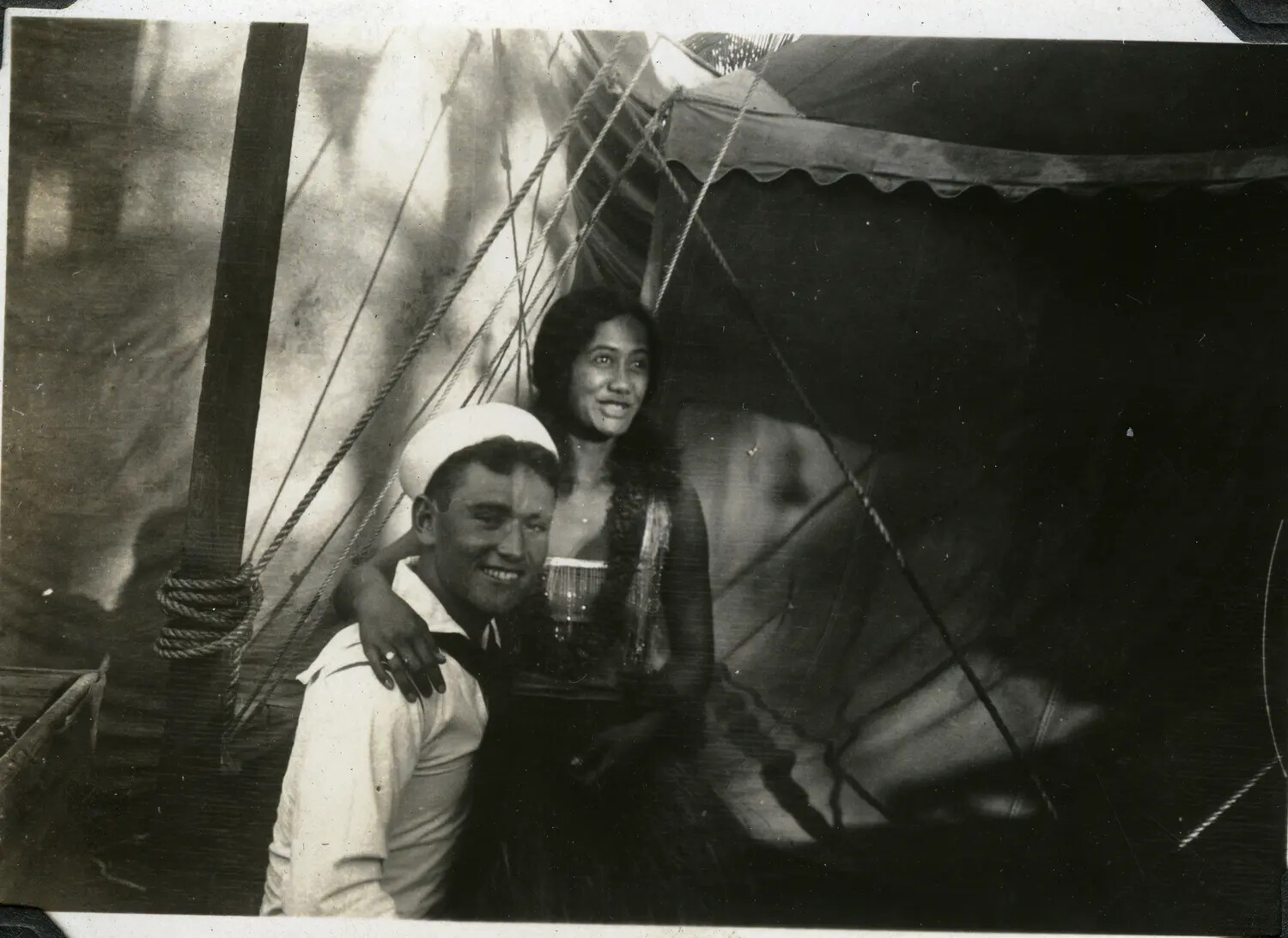Sailor Posing with Pacific Islander Woman in Traditional Dress, USS Maryland Album, 1930s