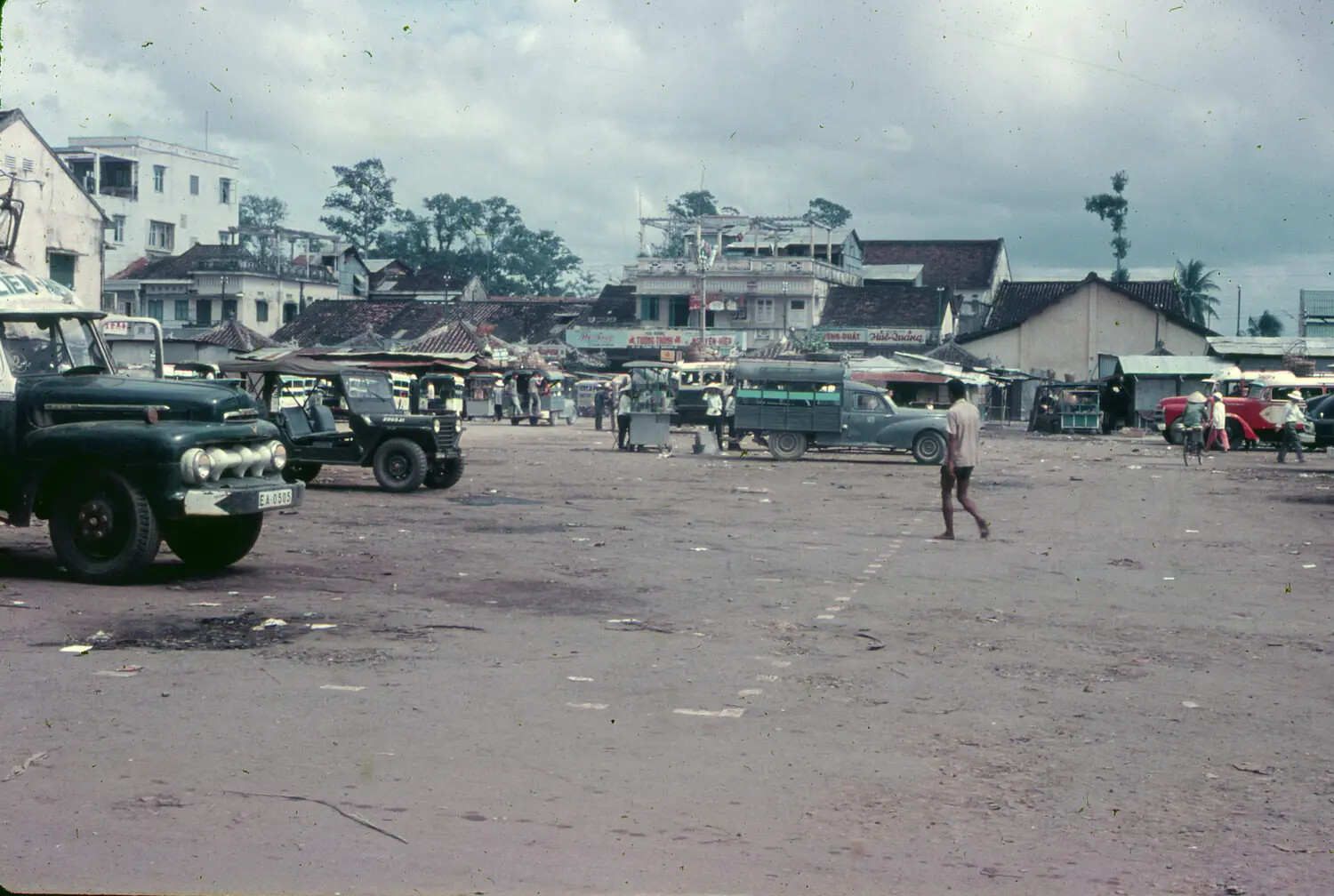 South Vietnamese Town Square with Military and Civilian Vehicles, 1965 (3rd Tactical Fighter Wing Collection)