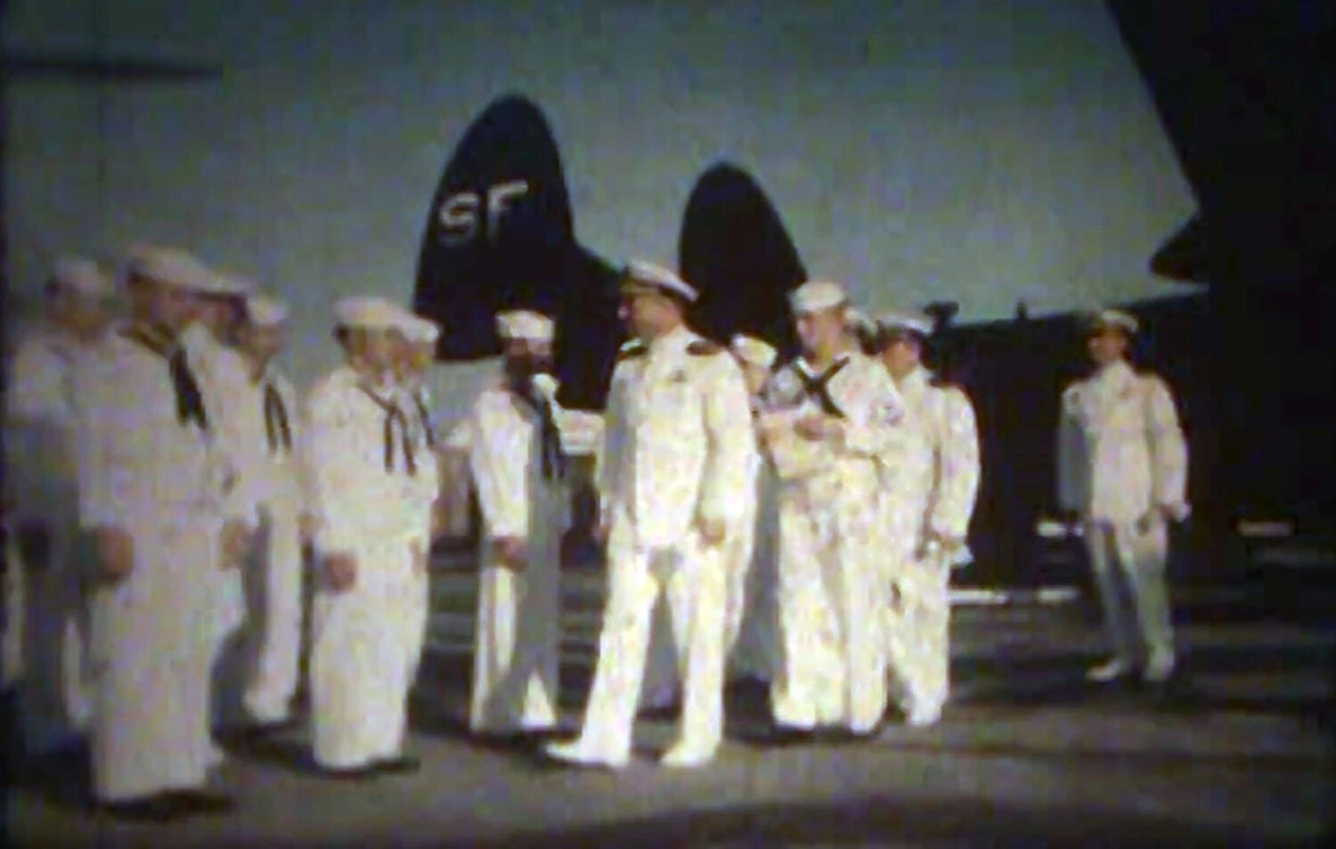 U.S. Navy Personnel in Dress Whites Assembled Beneath Twin-Tail Aircraft Marked 'SF', NAS Kaneohe Bay