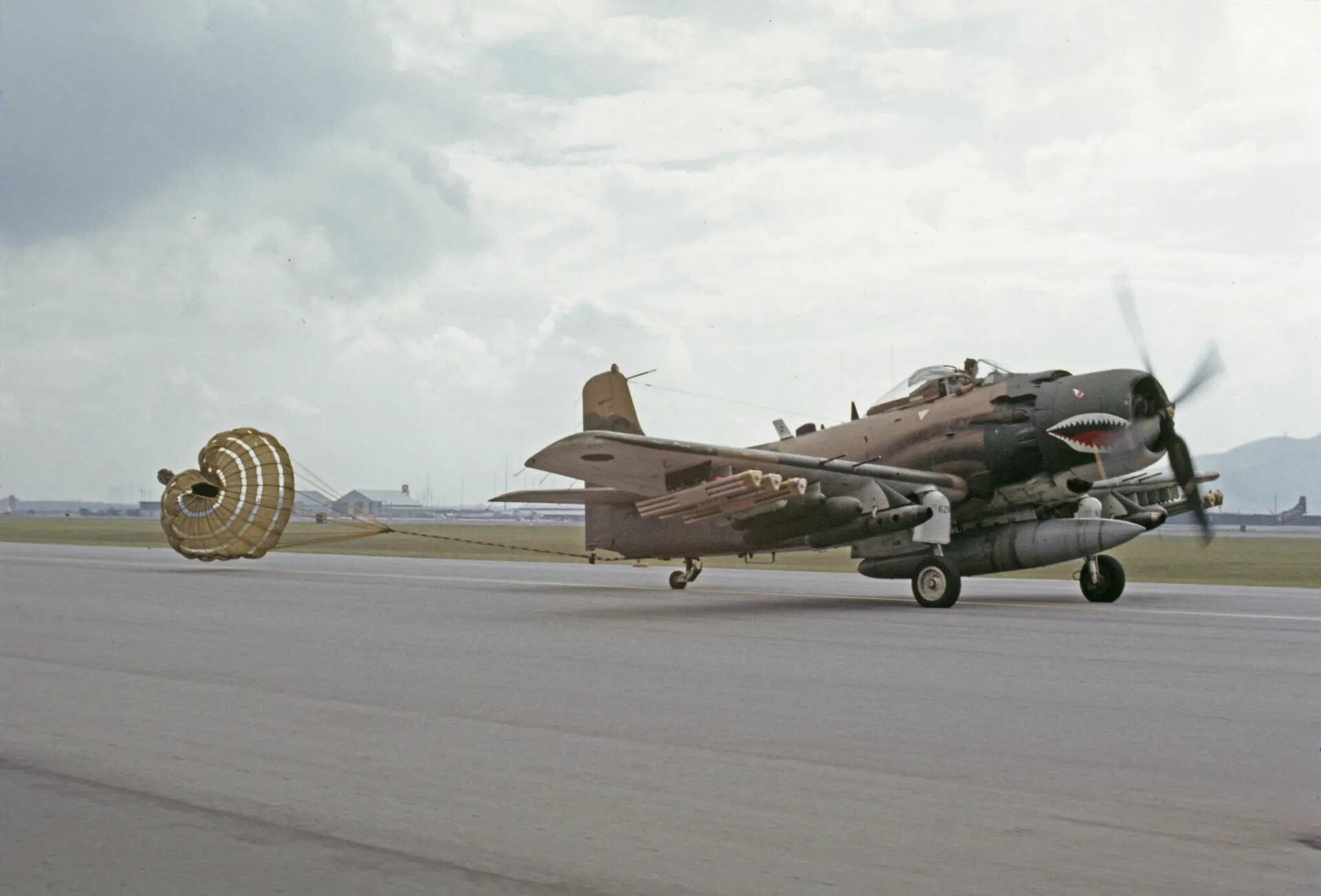 Twin-Engine Attack Aircraft Deploying Drag Chute on Landing Rollout