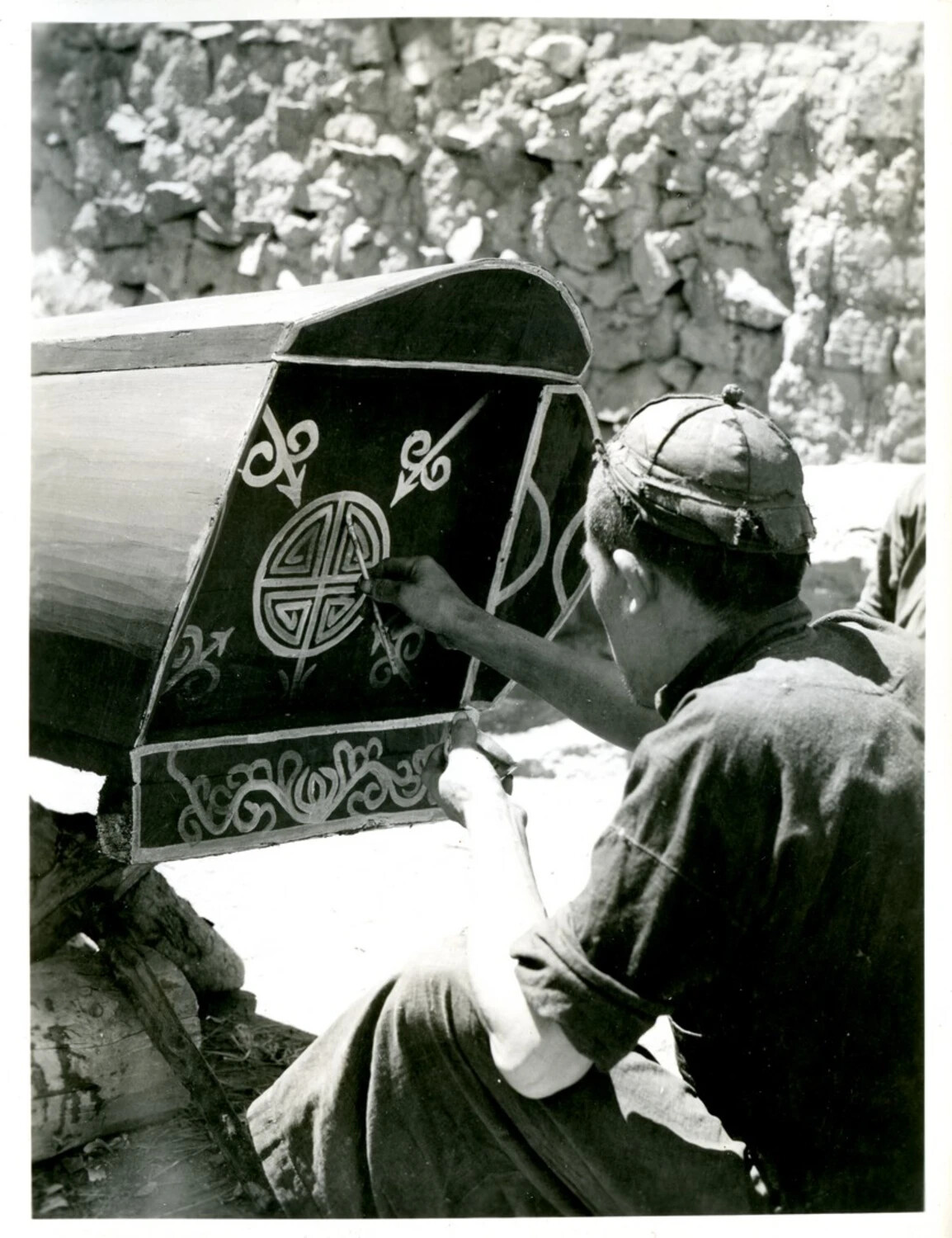 Craftsman Hand-Painting Traditional Motifs on a Wooden Coffin, China-Burma-India Theater, World War II Era