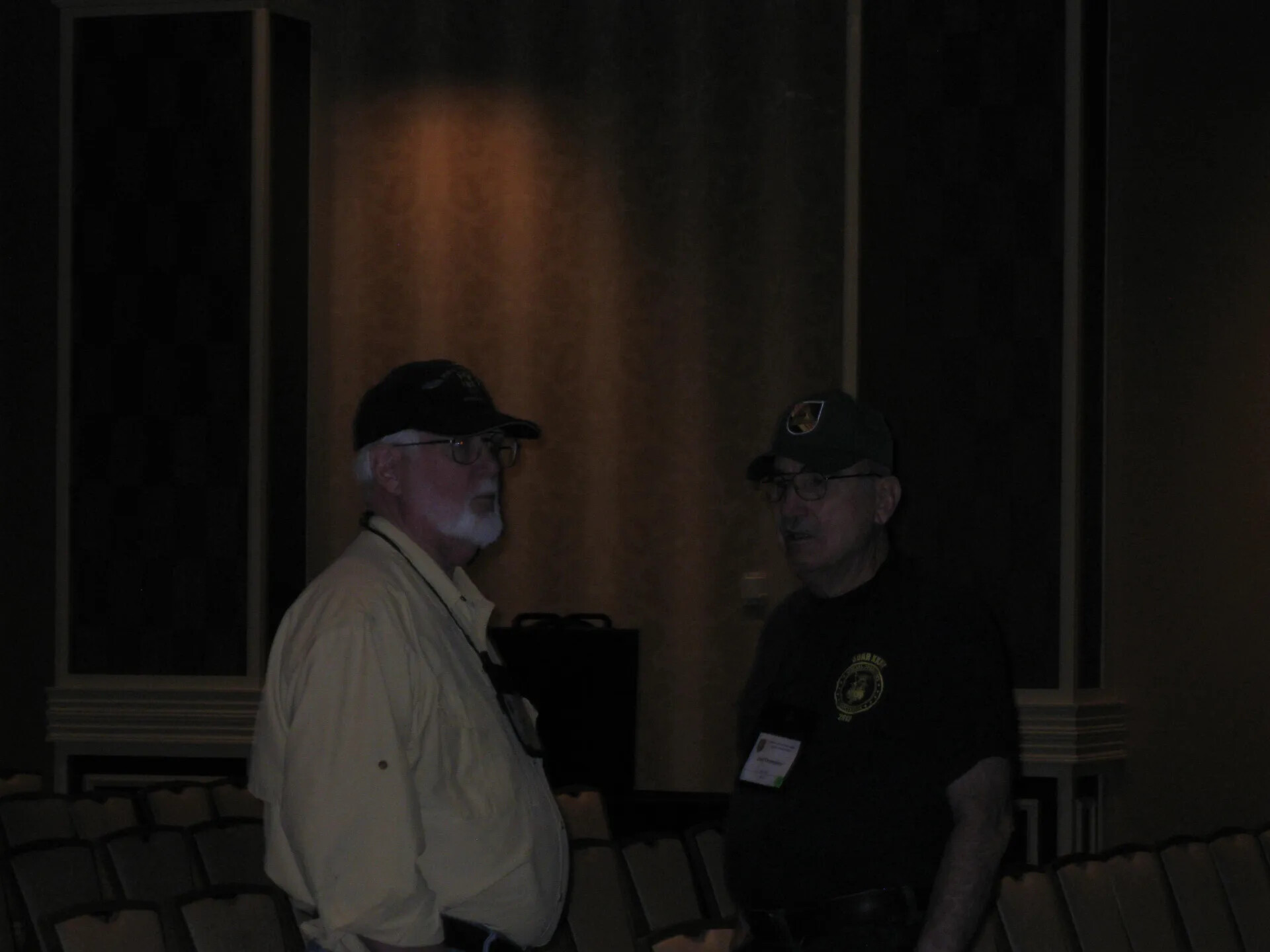 Two Attendees in Conversation Beside the Chair Rows, Special Operations Association Reunion XXXVII, Las Vegas, 2013