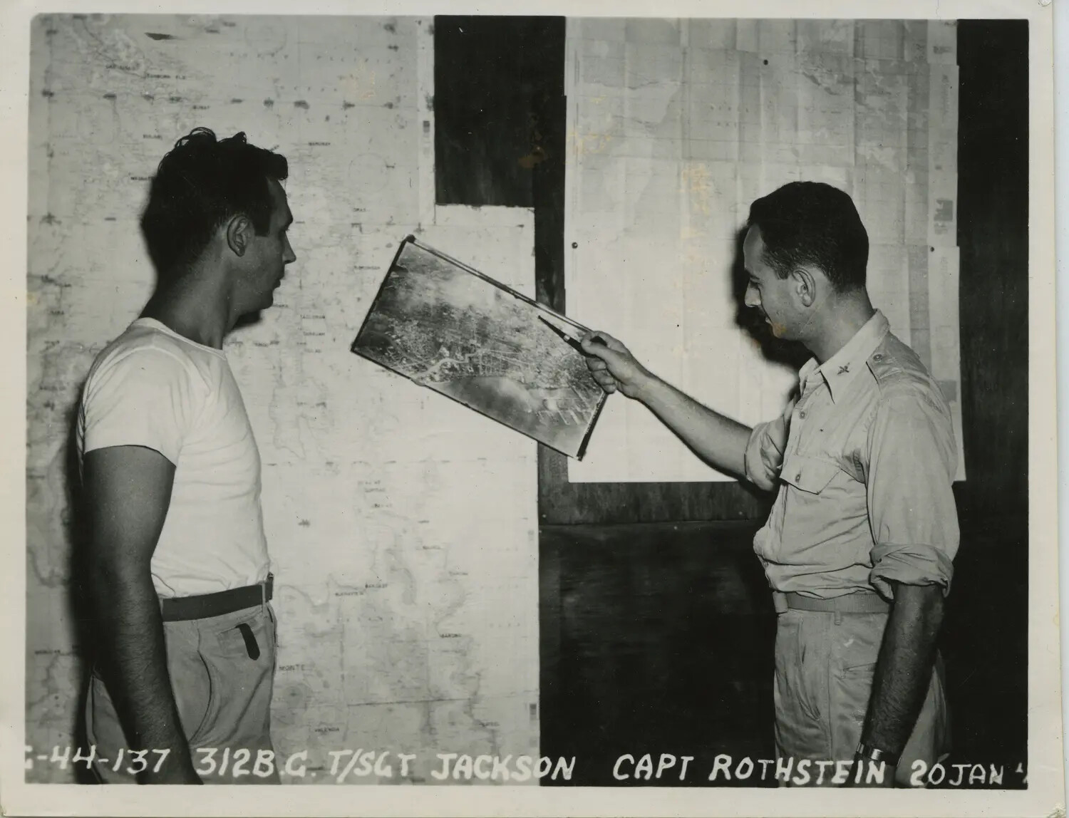 Capt. Rothstein and T/Sgt Jackson Reviewing Aerial Photograph, 312th Bomb Group, 20 January 1945