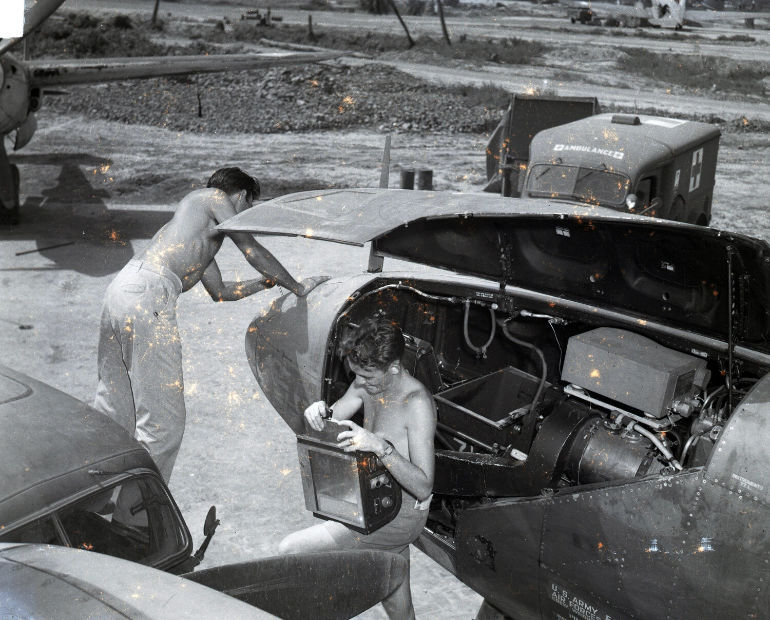 Ground Crew Servicing Aircraft Instrument Bay, CBI Theater, WWII
