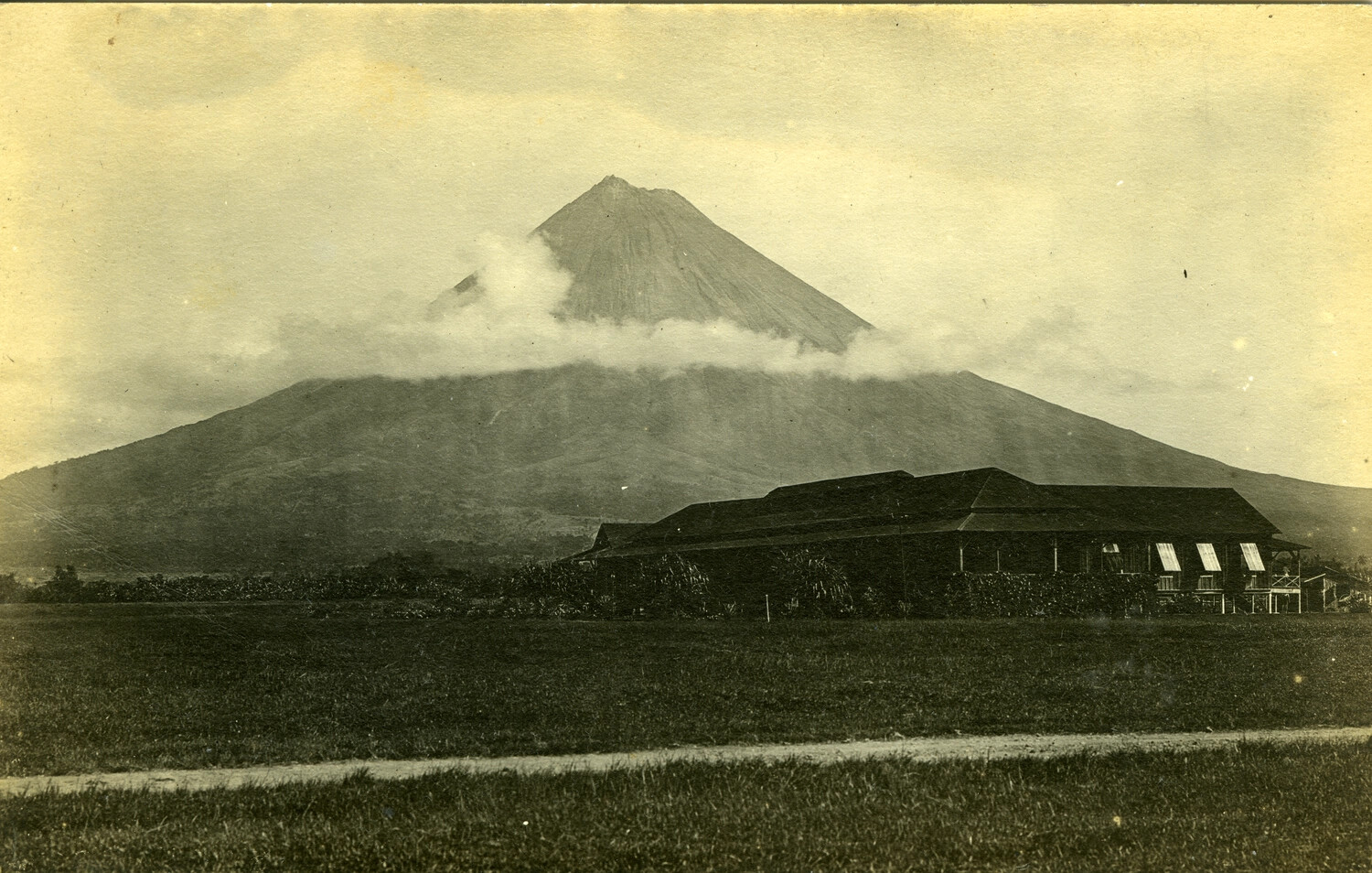 View of a Conical Volcano (probable Mayon Volcano) with Foreground Barracks Building, Philippines, Early 1900s