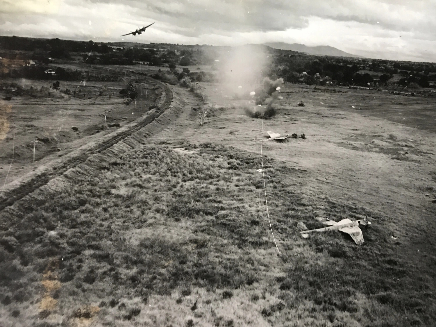 Low-Level Strafing Attack on Japanese Airfield with Parafrag Bombs, Pacific Theater