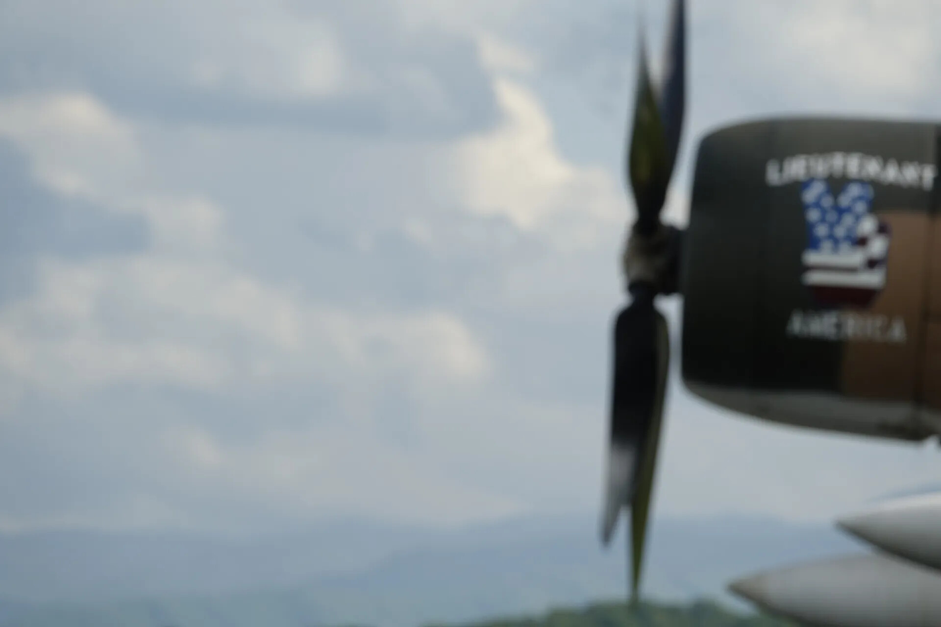 In-Flight View of Warbird Engine Cowling Marked 'Lieutenant America'