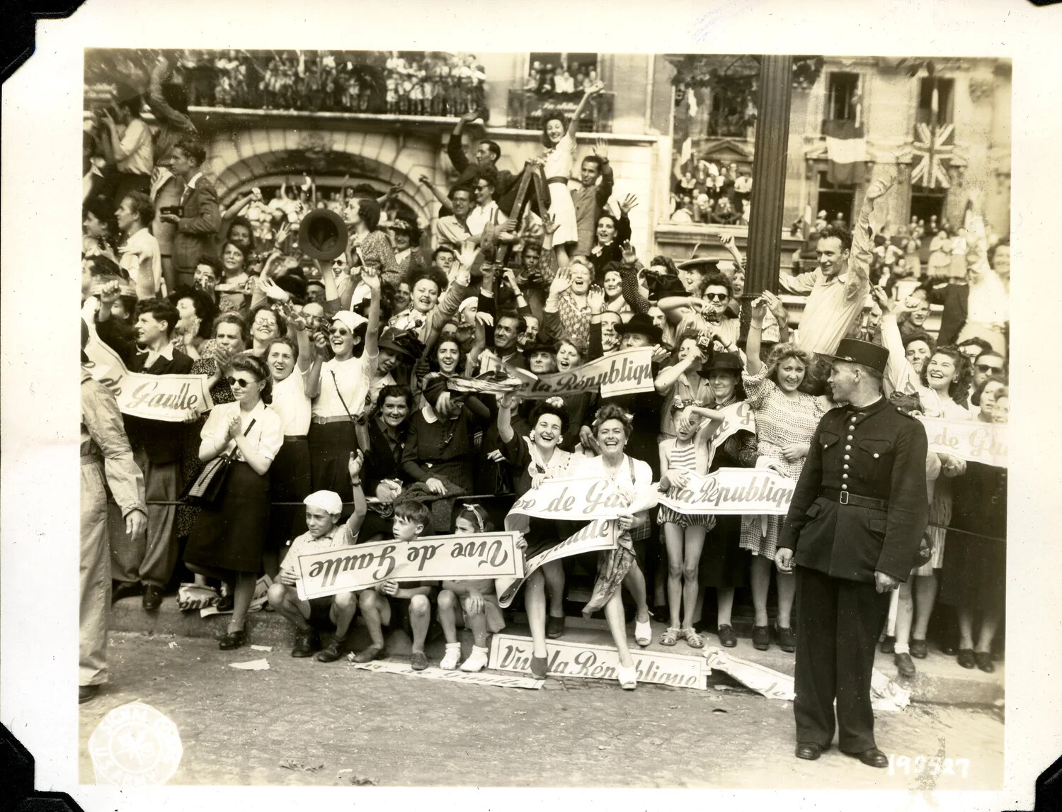 Crowd Celebrating the Liberation with 'Vive de Gaulle' Banners, France, 1944