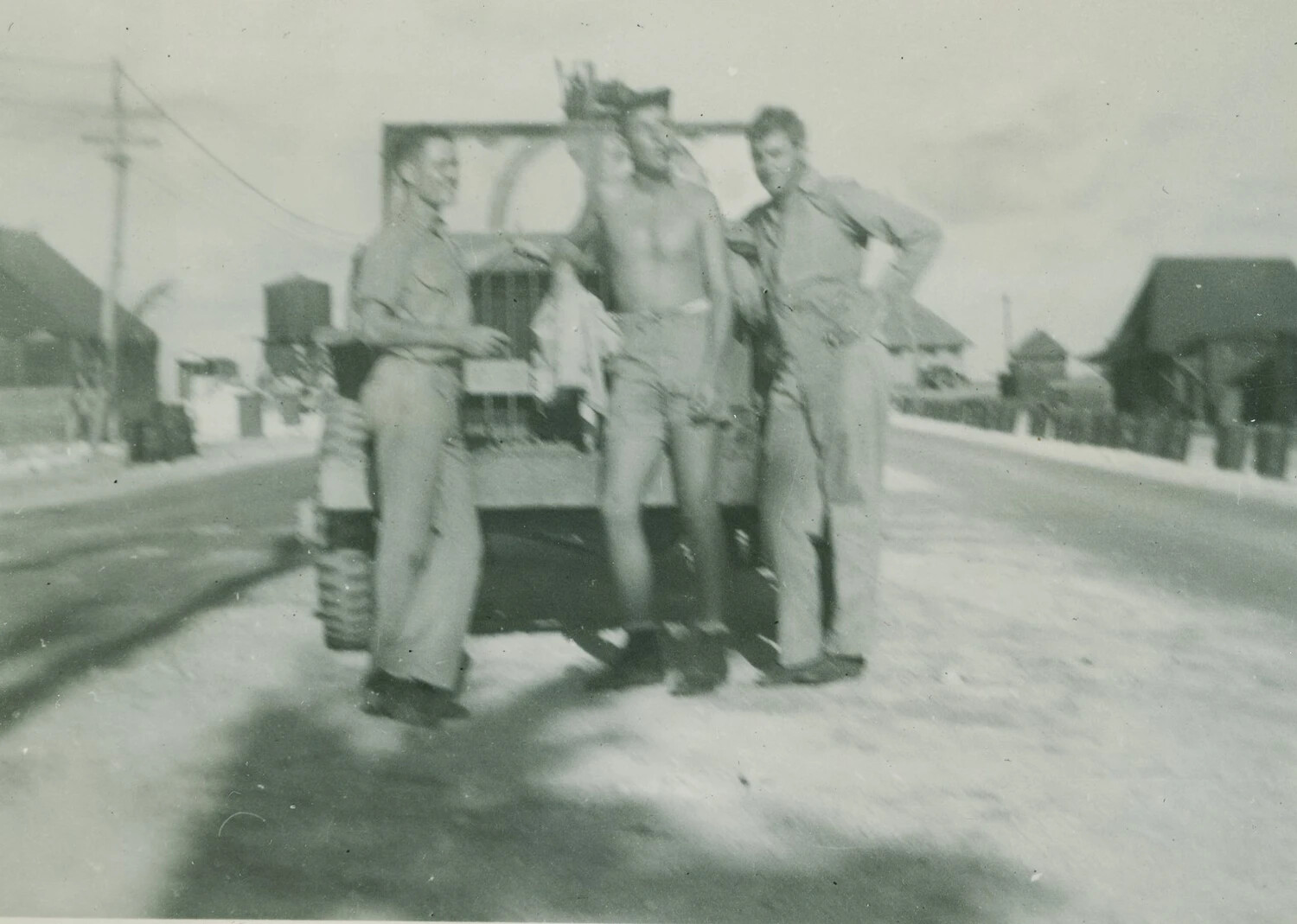 Three Servicemen with Tracked Vehicle on Base Road - McAleer Photo Album