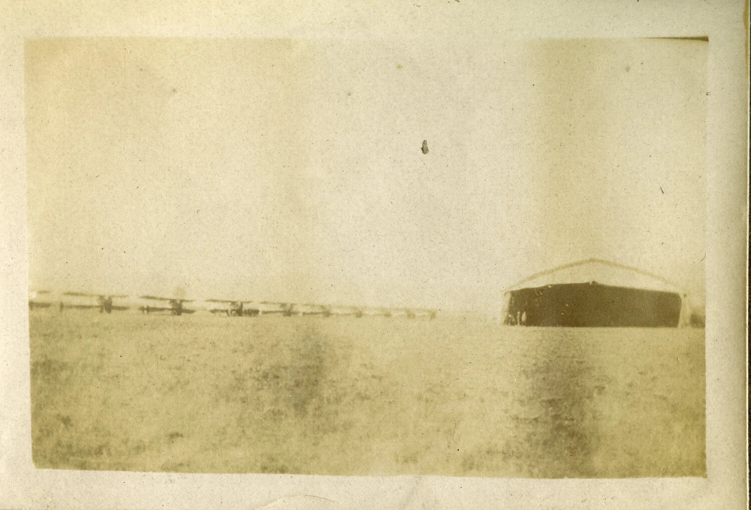 Row of Biplanes and Canvas Hangar on a WWI French Military Airfield