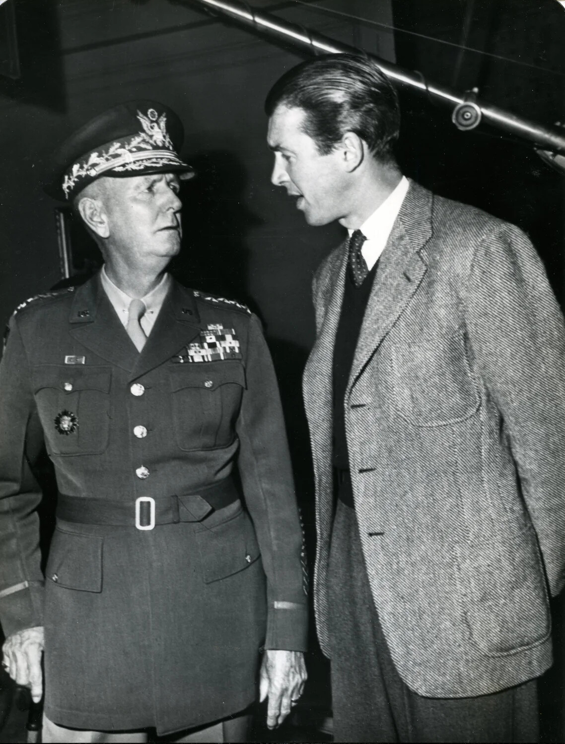 General Jonathan Wainwright in Dress Uniform Conversing with a Civilian on a Studio Set, 1949