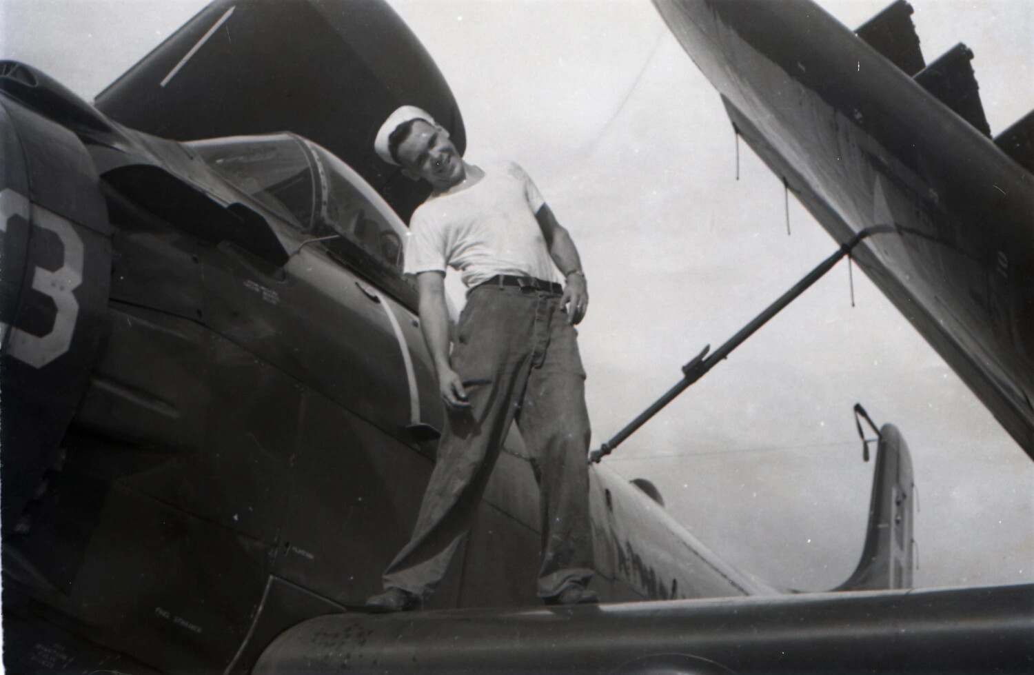 Sailor Standing on Wing of F4U Corsair Fighter Aboard USS Yorktown (CV-10), 1953