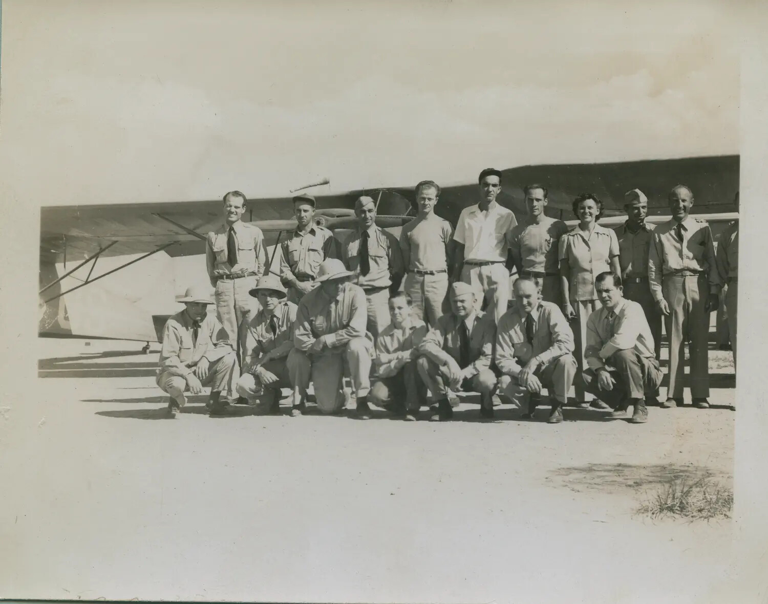 Group Portrait of Servicemen with Liaison Aircraft at Forward Airfield
