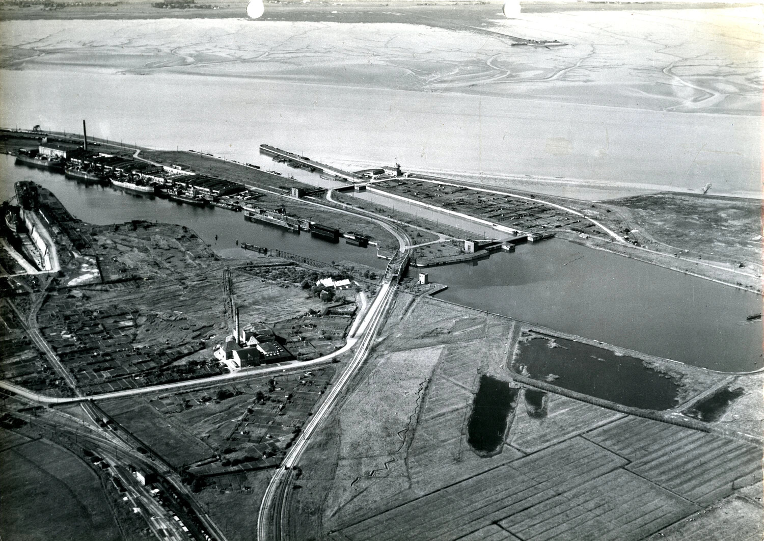 Aerial Reconnaissance Photograph of European Canal, Lock, and Industrial Waterfront, WWII European Theater