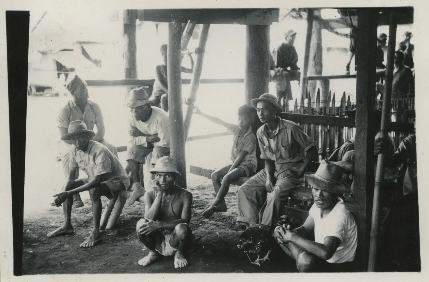 Filipino Civilians Gathered Beneath a Shelter Near a US Airbase, 312th Bomb Group Collection, WWII Pacific Theater