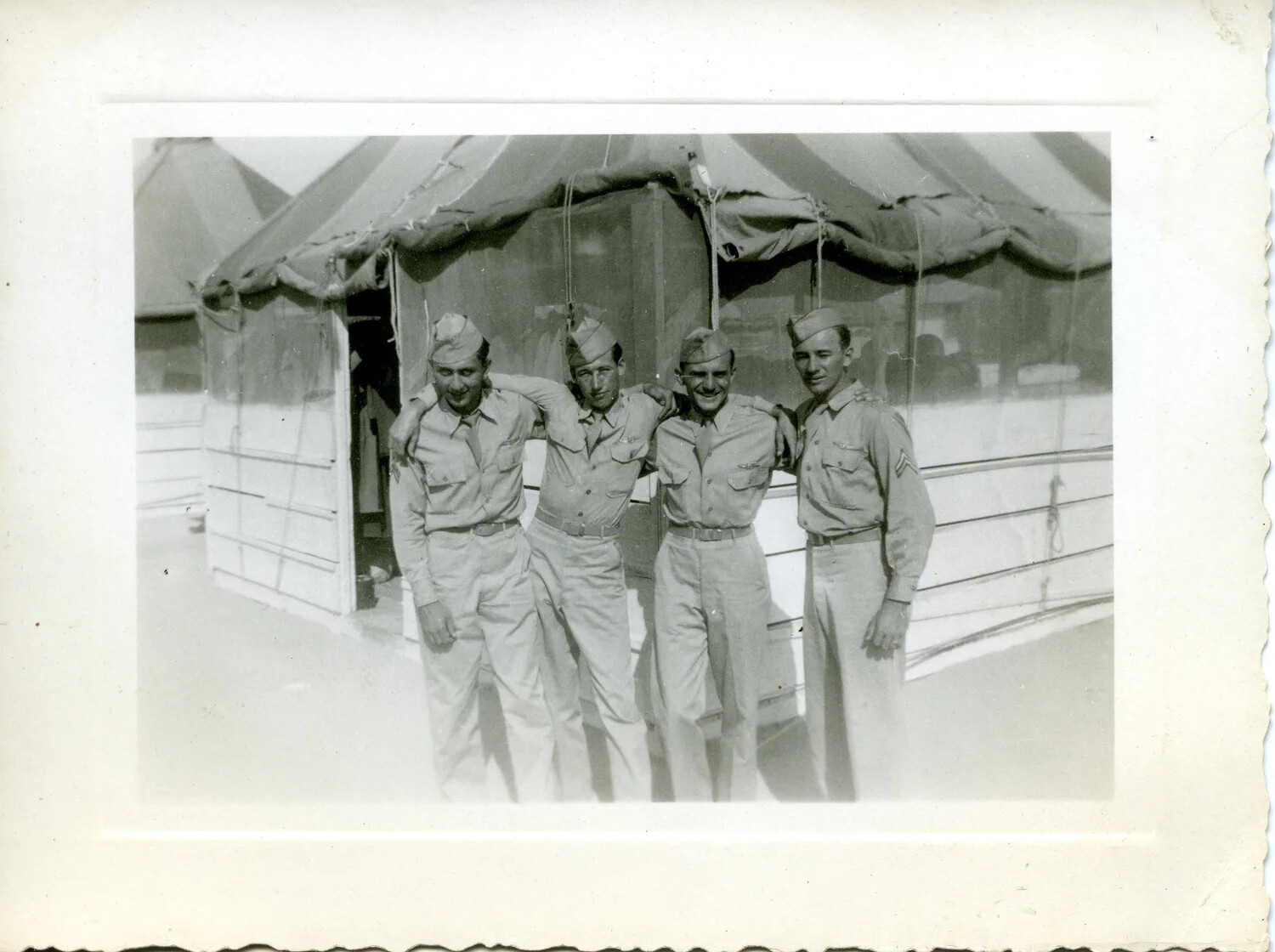 Four Airmen Posing Before a Screened Squadron Tent, WWII Pacific Air Base