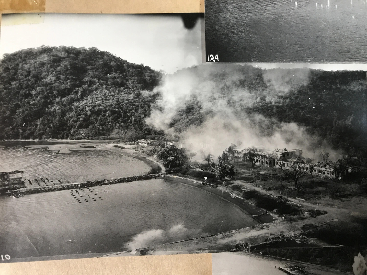 Aerial Strike Photograph: Coastal Building Complex Under Attack, Pacific Theater, WWII