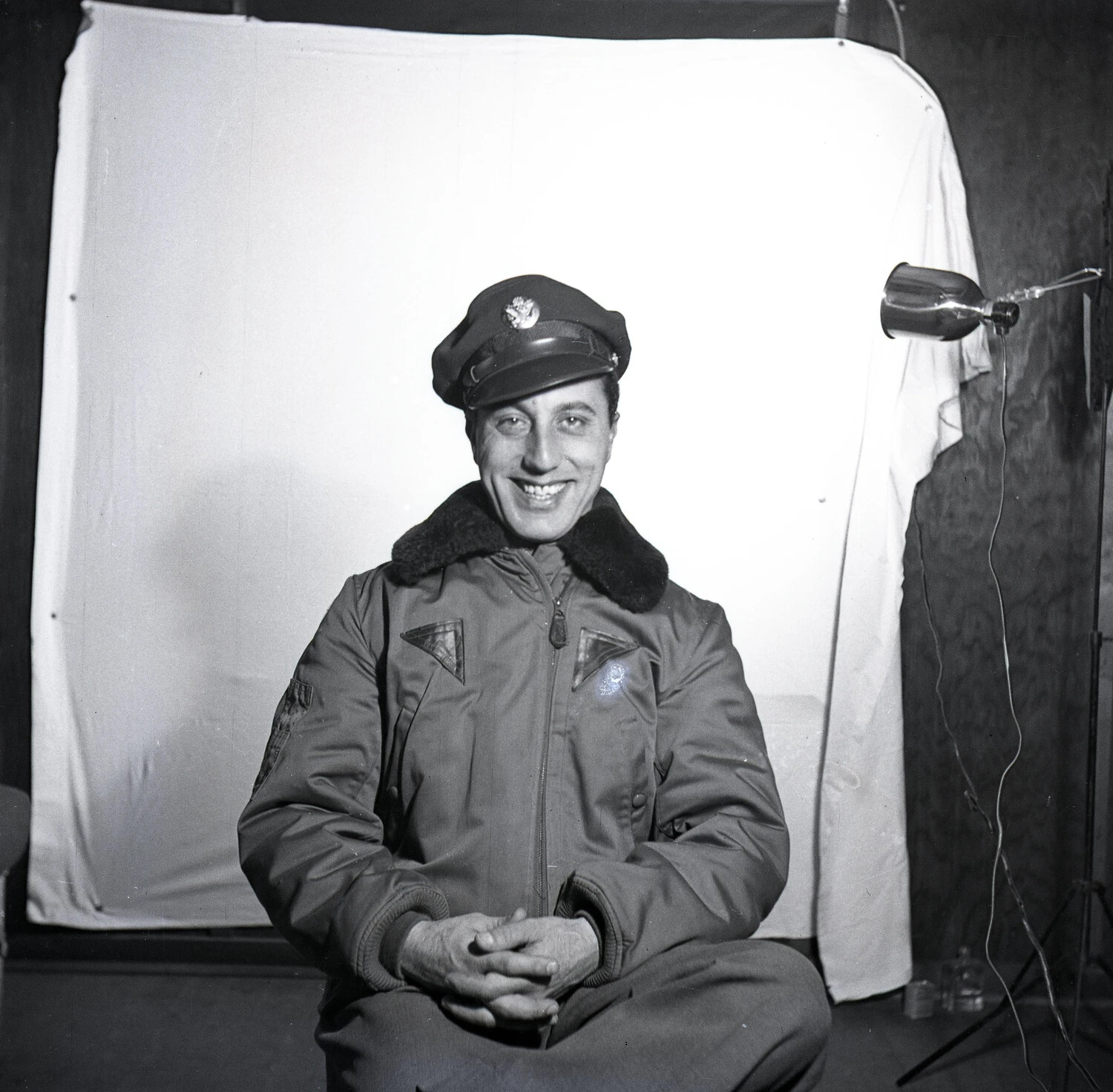 Portrait of Serviceman in Winter Flying Jacket and Service Cap, Laughing