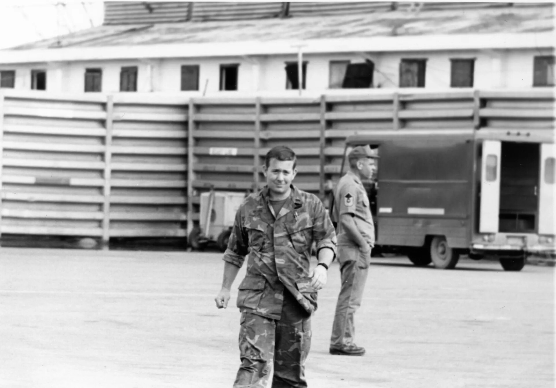 USAF Airman in Camouflage Fatigues on Base Ramp, Southeast Asia