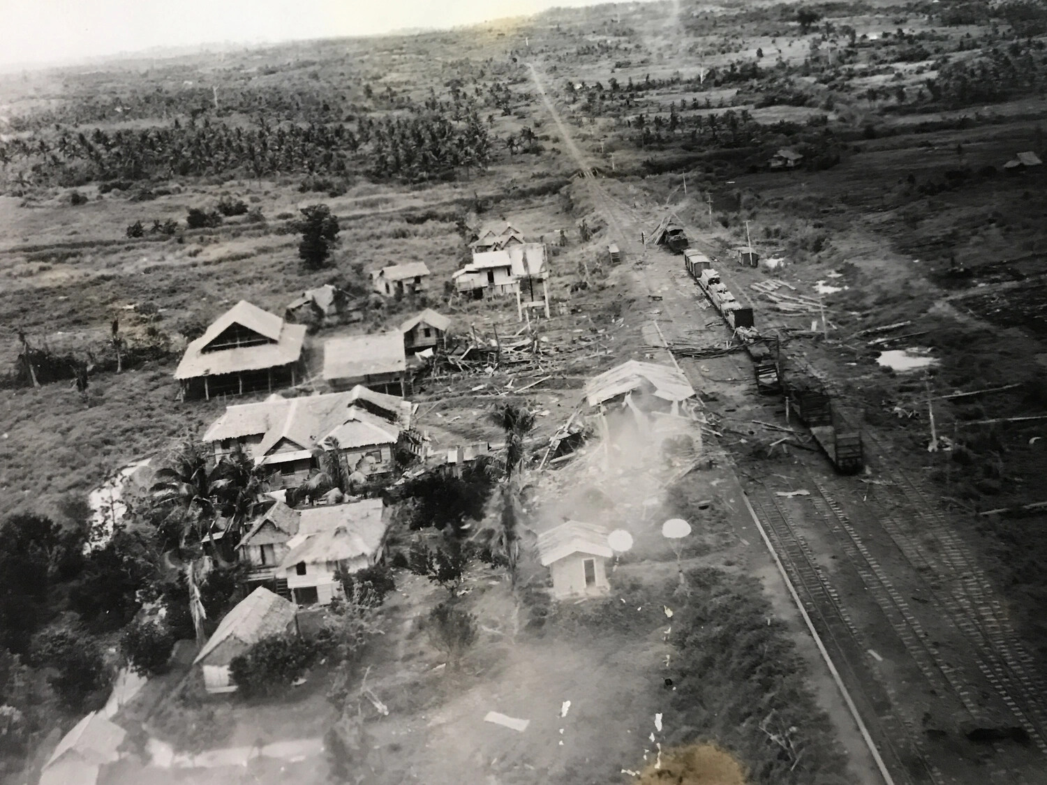 Aerial Strike Photograph of Rail Yard and Village Under Attack, Likely Philippines Campaign, 312th Bomb Group