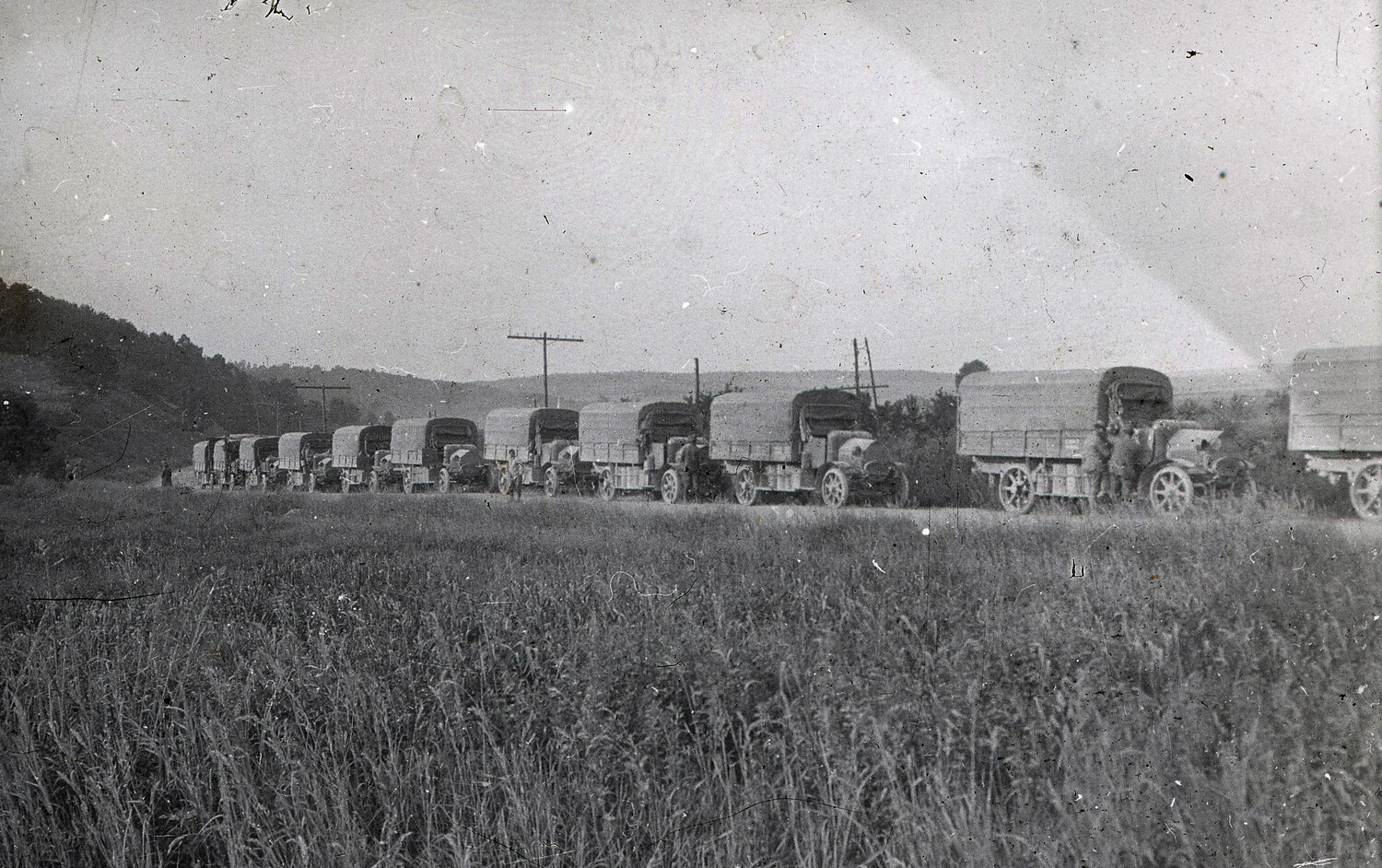 Convoy of WWI-Era Military Supply Trucks Parked Along a Roadside, France, circa 1917-1918