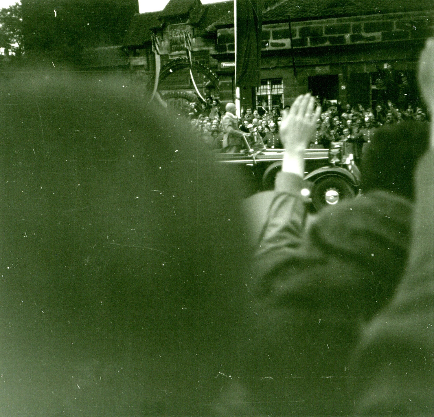 Crowd Saluting Passing Motorcade Near Historic Gate, 1930s Germany (Companion Frame)