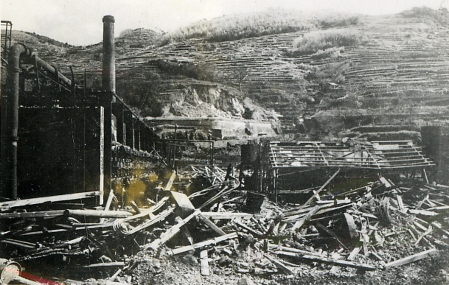Ruins of a Bombed Industrial Facility Beneath Terraced Hillside, Japan, Believed Post-World War II