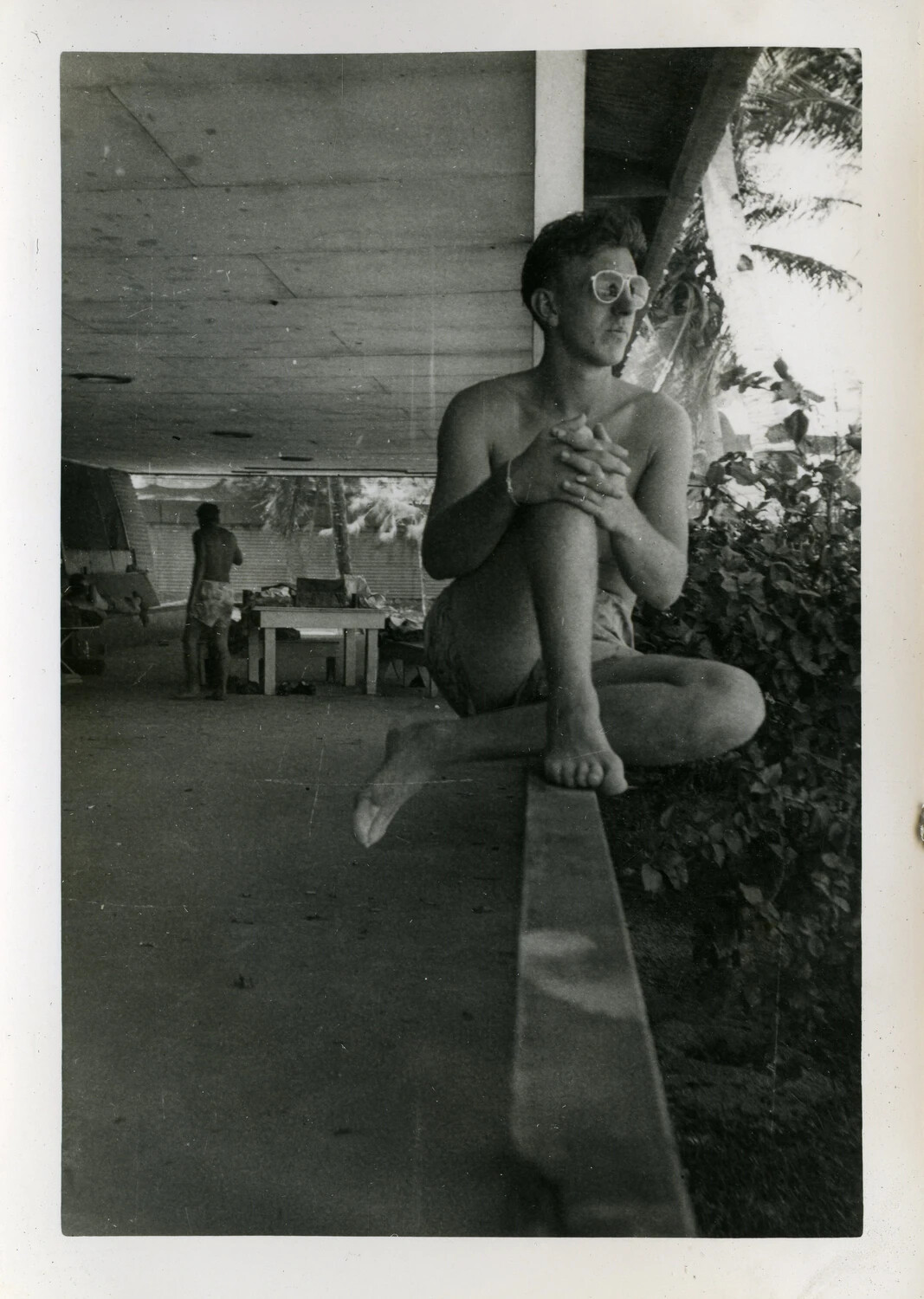 Sailor Relaxing in Swim Trunks Under Open-Air Shelter, Agana, Guam - VR-6 Squadron Photo Album