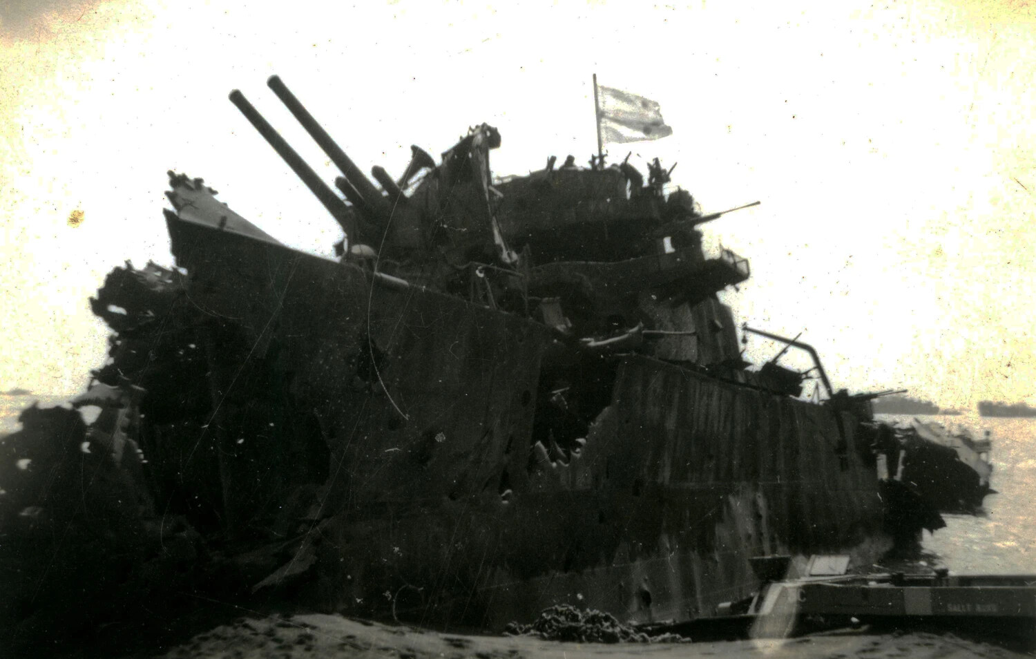 Wreck of Damaged Naval Vessel Near Shore, Iwo Jima, 1945