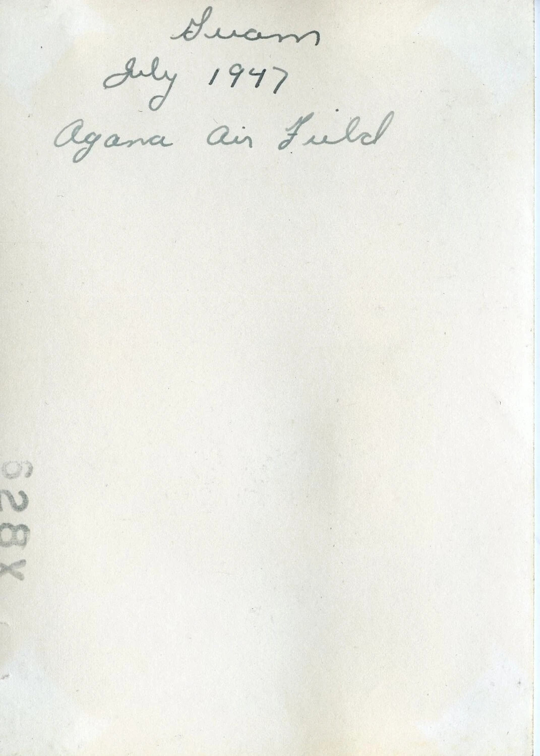 Verso of Photograph with Handwritten Caption "Guam / July 1947 / Agana Air Field"