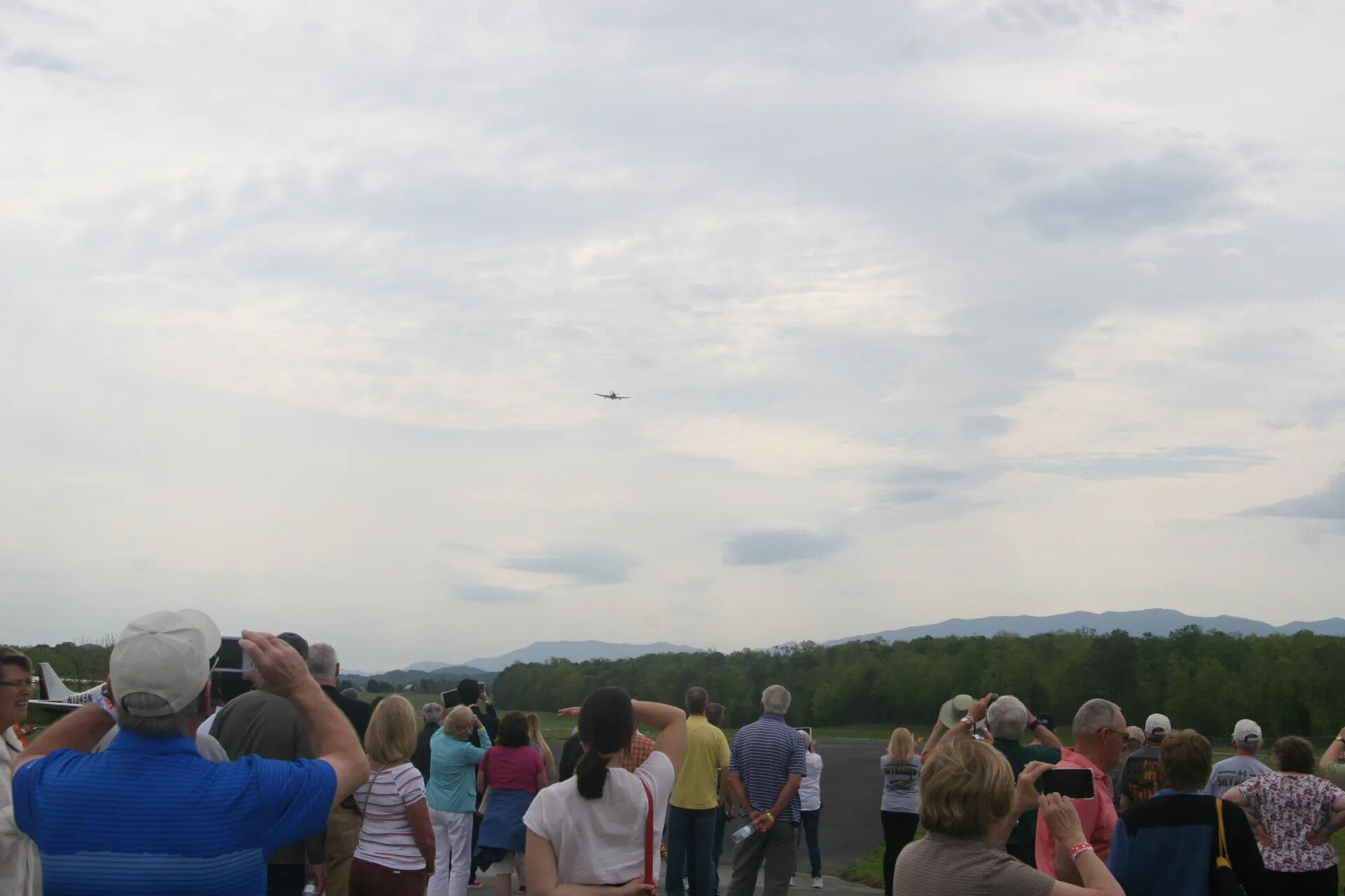 Spectators Watch A-1 Skyraider Flyover Beside Parked Light Aircraft, Operation Tailwind Event, 2016
