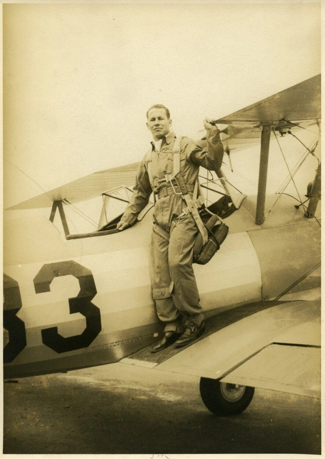 Aviation Cadet Standing on Biplane Trainer Wing, Side Number 83, World War II Era