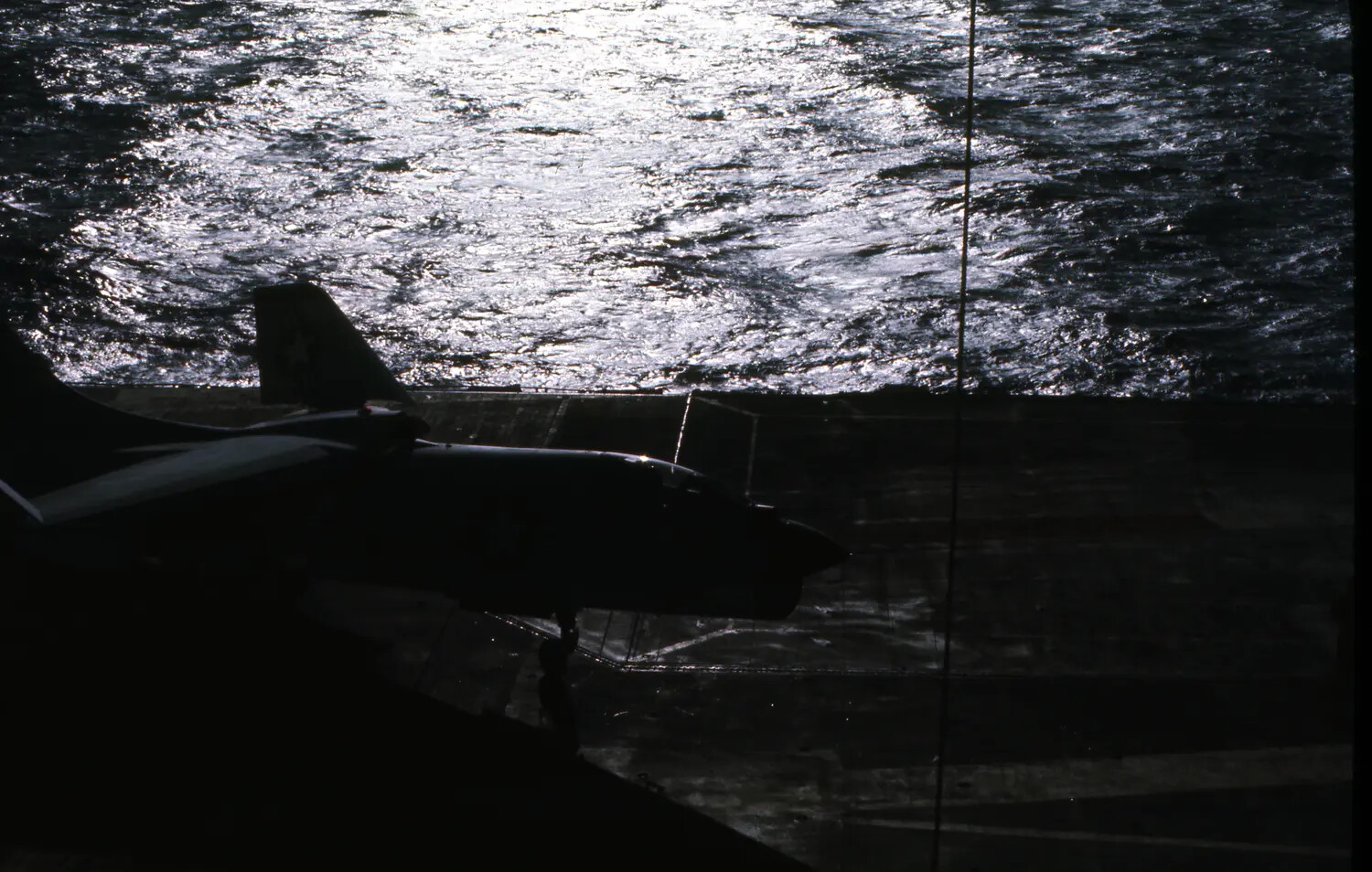Silhouetted Carrier Jet on the Flight Deck of USS Ticonderoga, Vietnam War Era