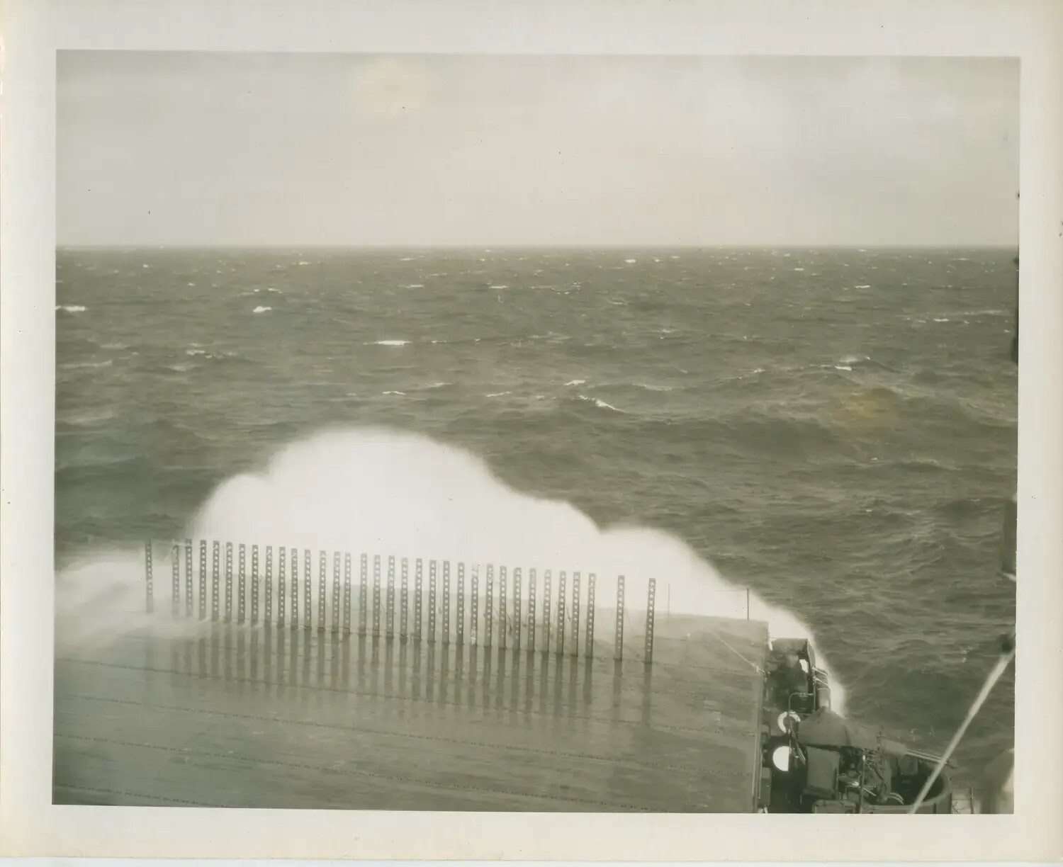 Heavy Sea Breaking Over the Flight Deck of USS Petrof Bay (CVE-80)