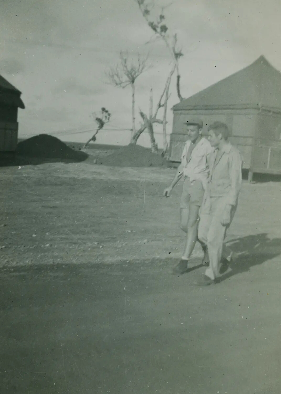 Two Servicemen Walking Through Camp Area, McAleer Album, Pacific Theater, WWII