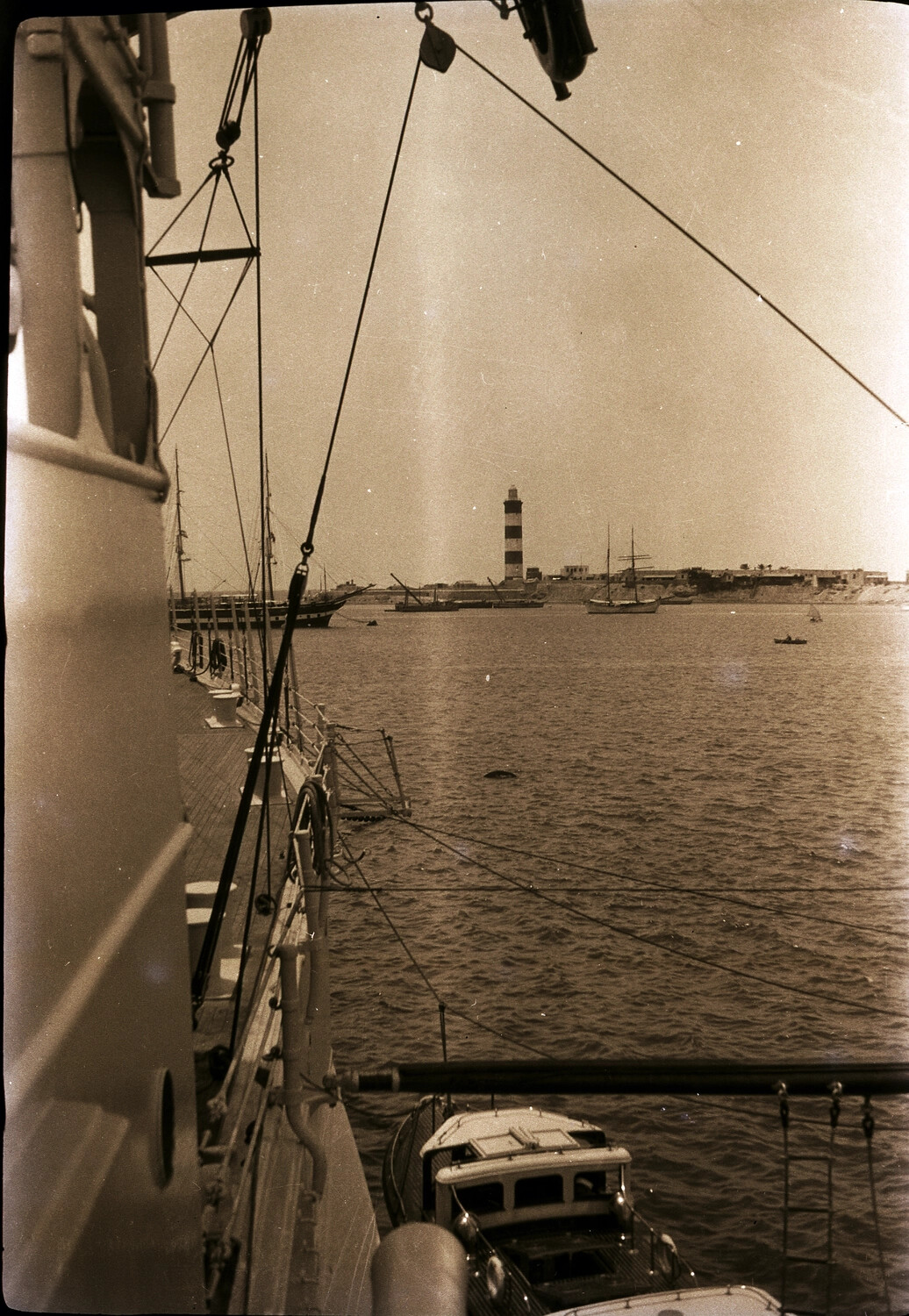 View of Harbor and Striped Lighthouse from Ship's Deck, US Navy Asiatic Station, 1930s