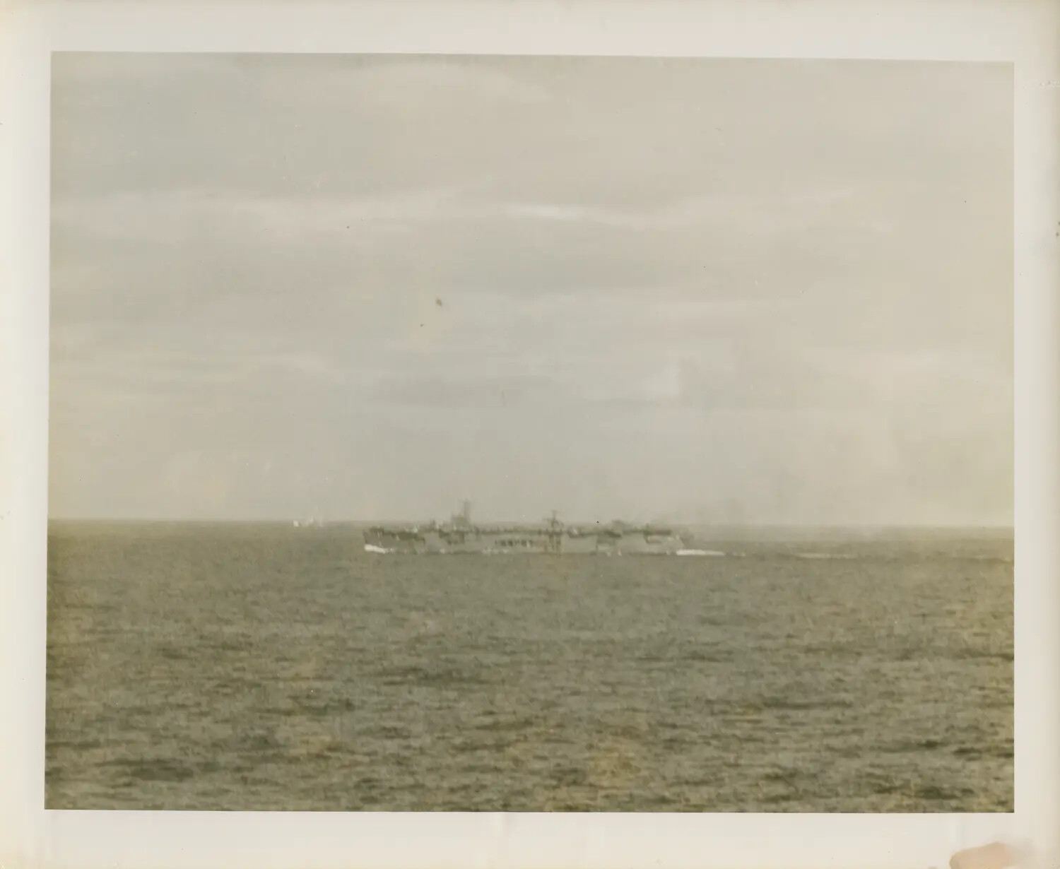 Distant View of a Casablanca-Class Escort Carrier Underway at Sea, Pacific Theater, World War II