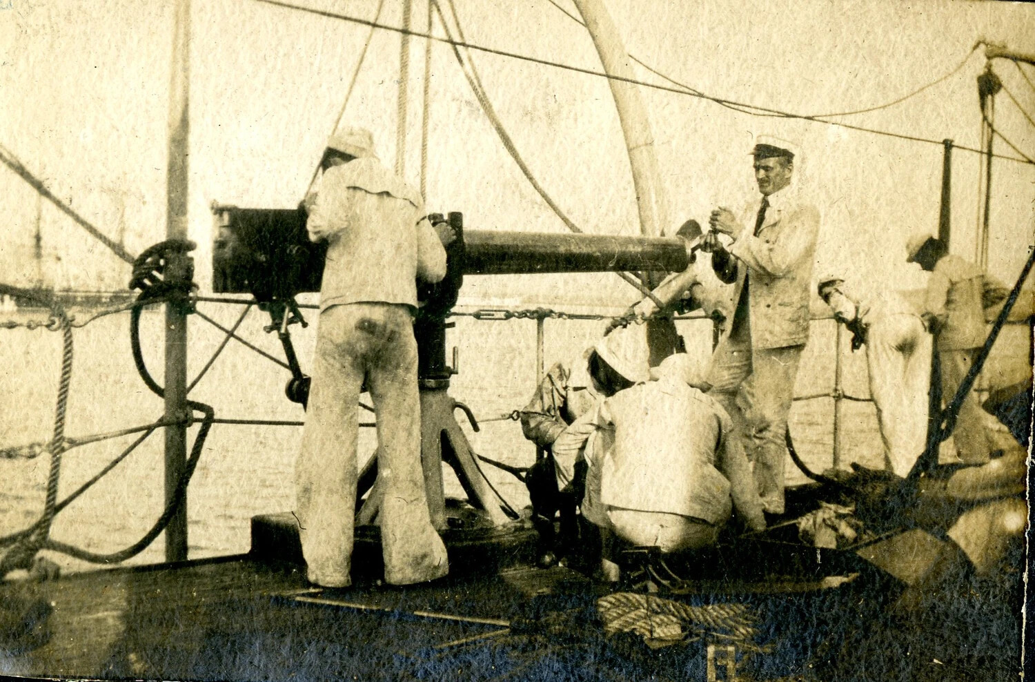 USS Columbia Album: Sailors Manning a Deck Gun, Early 20th Century