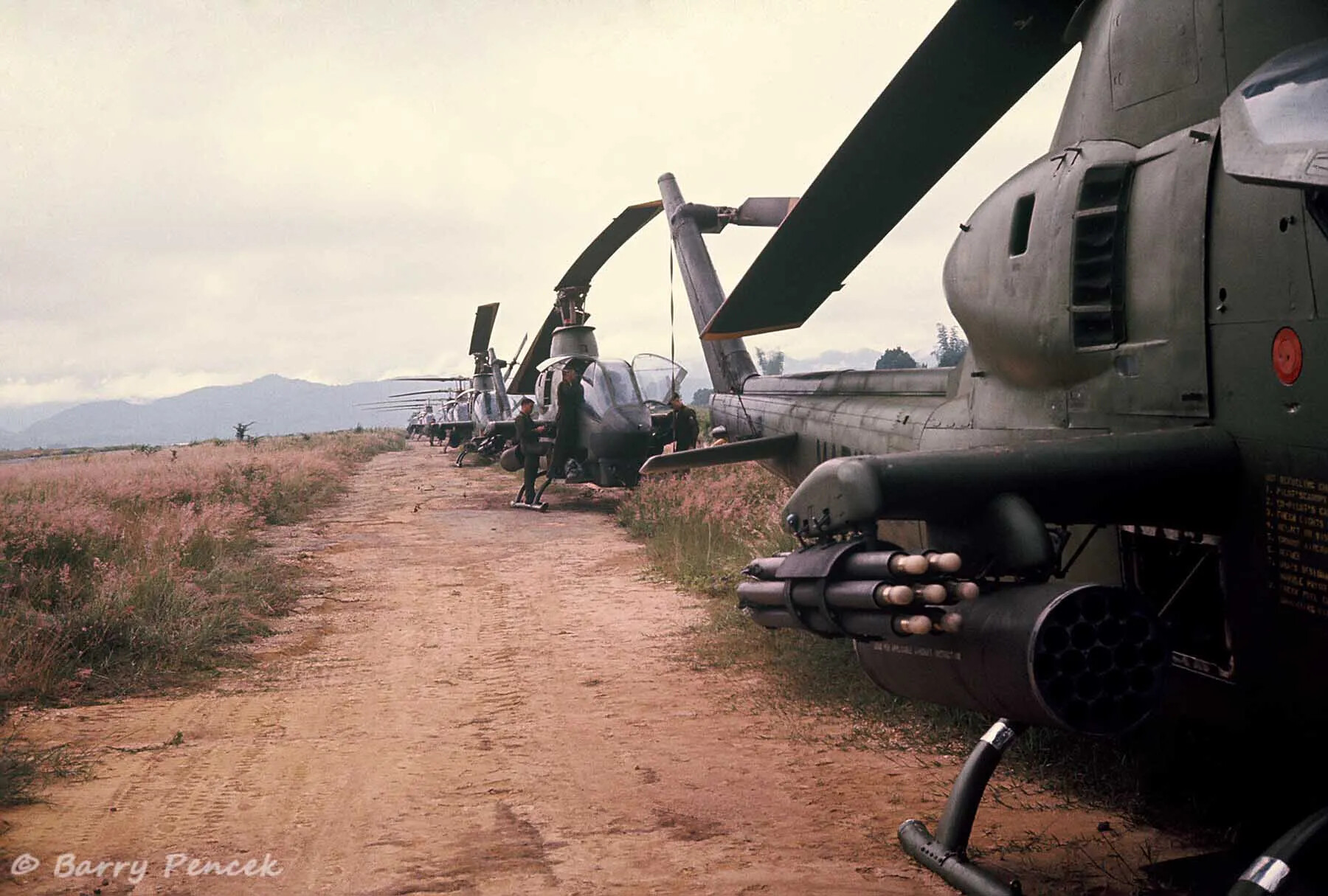 Row of AH-1 Cobra Attack Helicopters on Dirt Airstrip, Vietnam, Operation Tailwind Collection