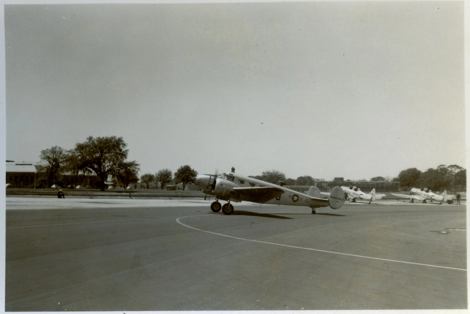 Twin-Engine Beechcraft Trainer Aircraft on Ramp, Naval Air Station Pensacola, Korean War Era
