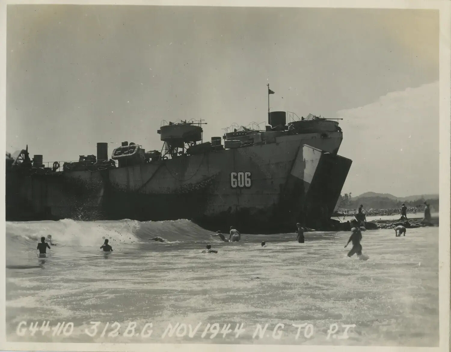 Servicemen Swimming Near Beached LST-606, 312th Bombardment Group, November 1944