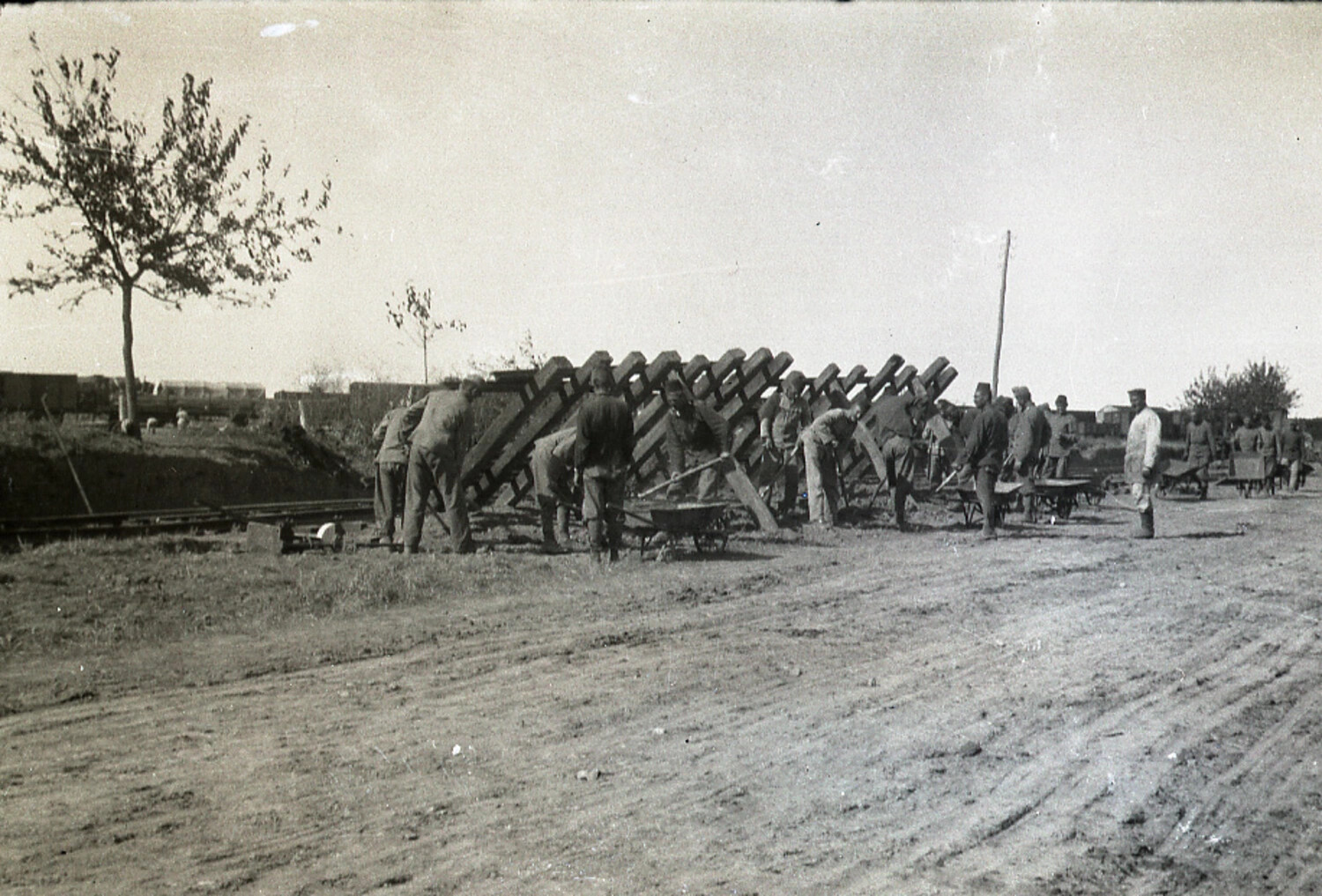 German Work Detail Erecting Timber Obstacle Barrier Beside Rail Line, World War I