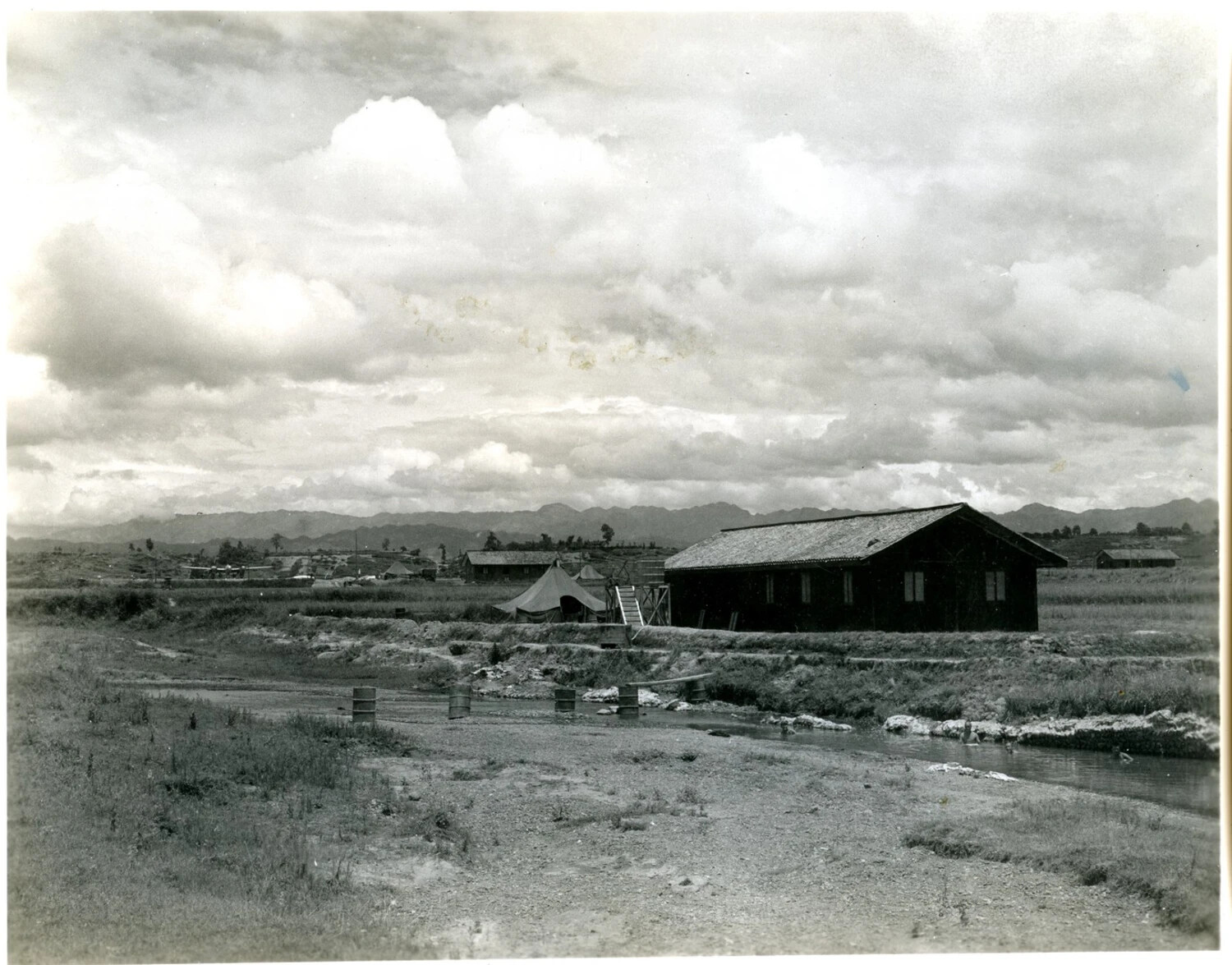 Airbase Barracks and Stream Crossing with Mountain Backdrop, CBI Theater, World War II